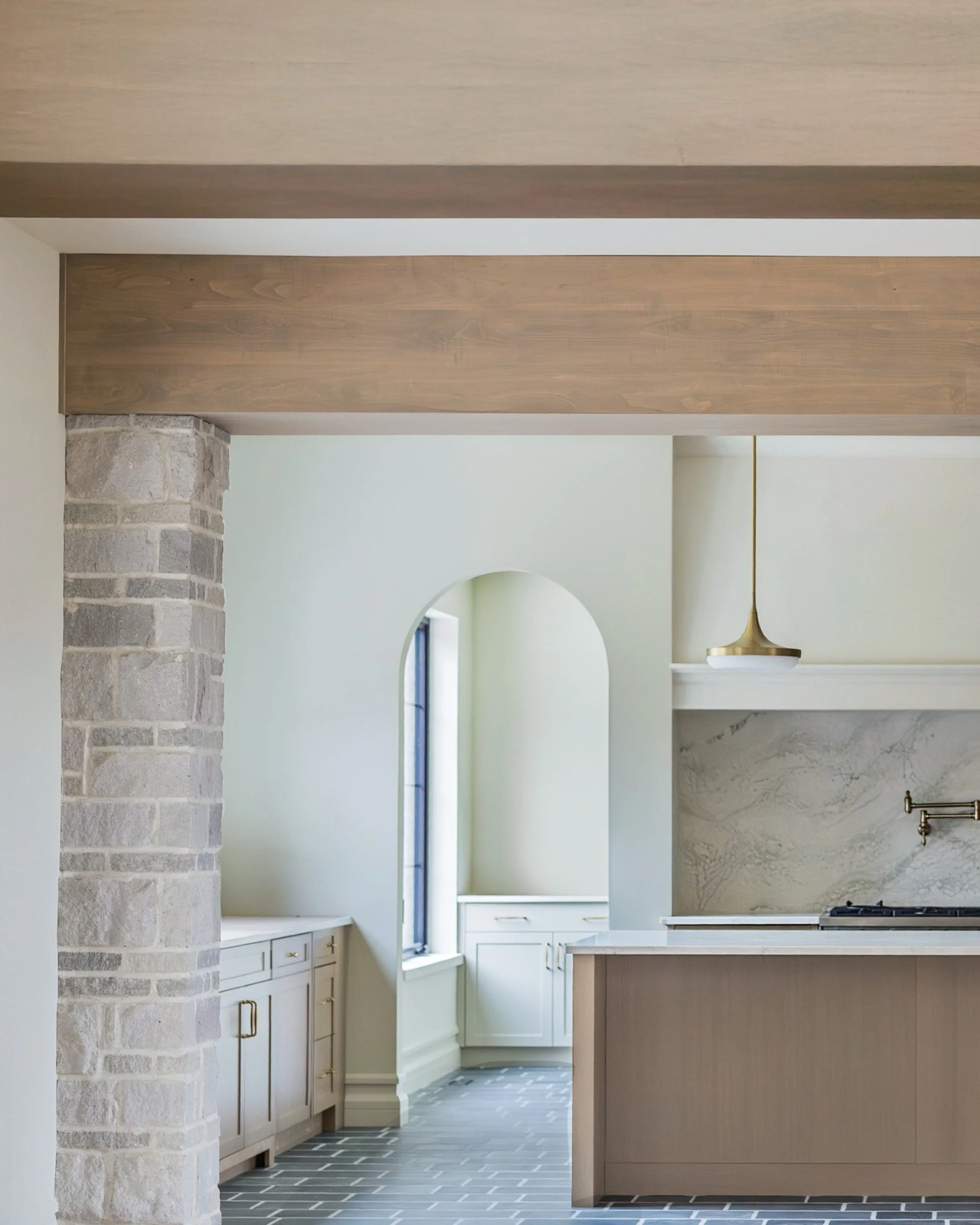 JURIST GROVE | Kitchen

Stone | @arriscraftstone 
Counters | @cambriasurfaces 
Lights | @j.d.lighting 
Plumbing | @deltafaucet 
Appliances | @bertazzoni_official 
Sink | @blancocanada 

Design | @alyciavisserdesigns
