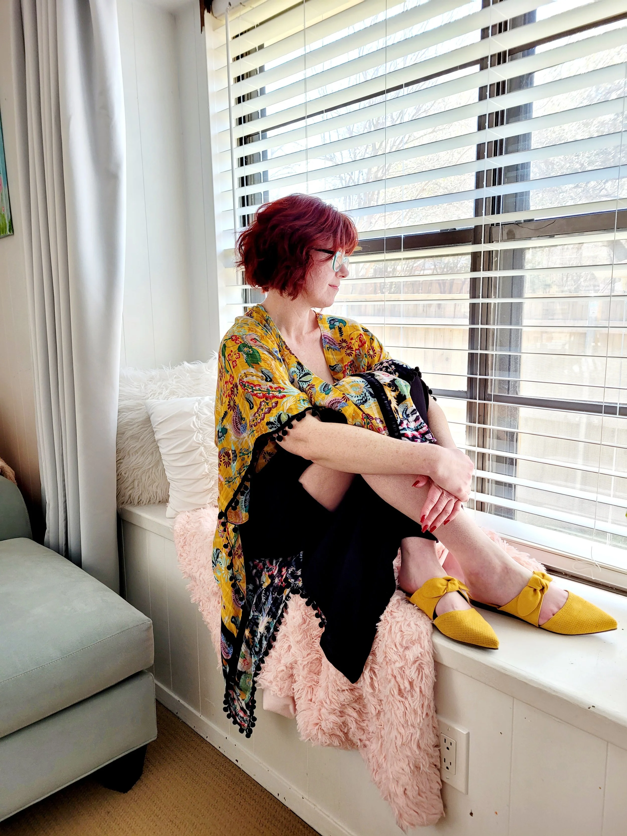 Image of Kate Smith looking out the window - Kajabi Sales Page Design