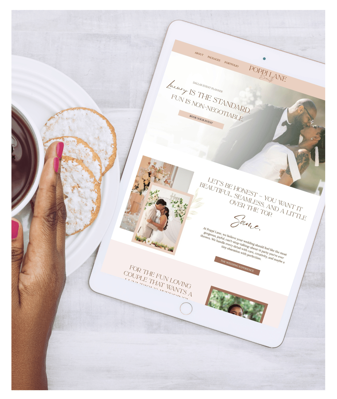Image of woman's hand near tablet showing a wedding planner website design example