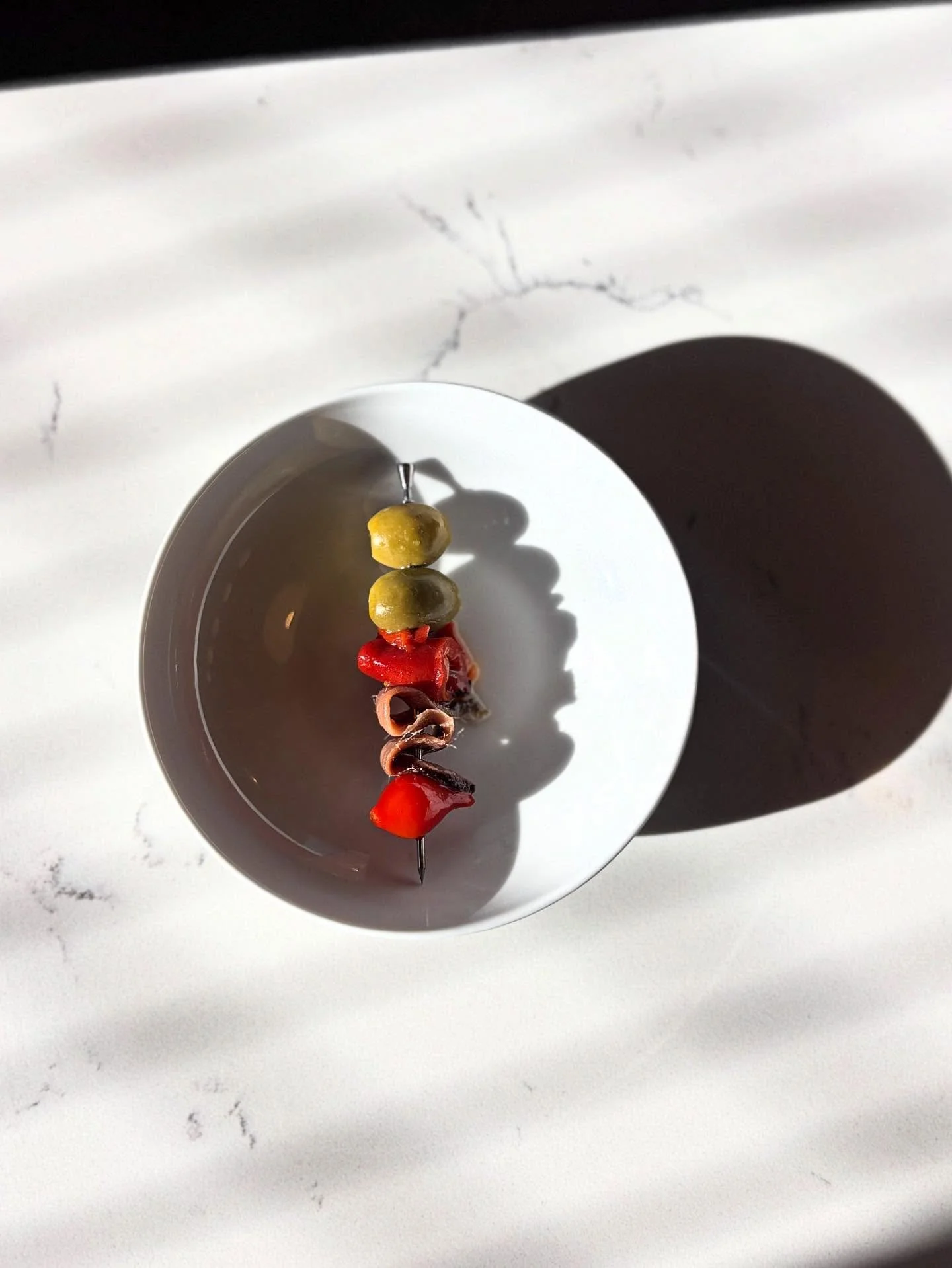 G I L D A  P I N T X O

For those of you looking for the perfect salty bite with your drink. This one is for you.