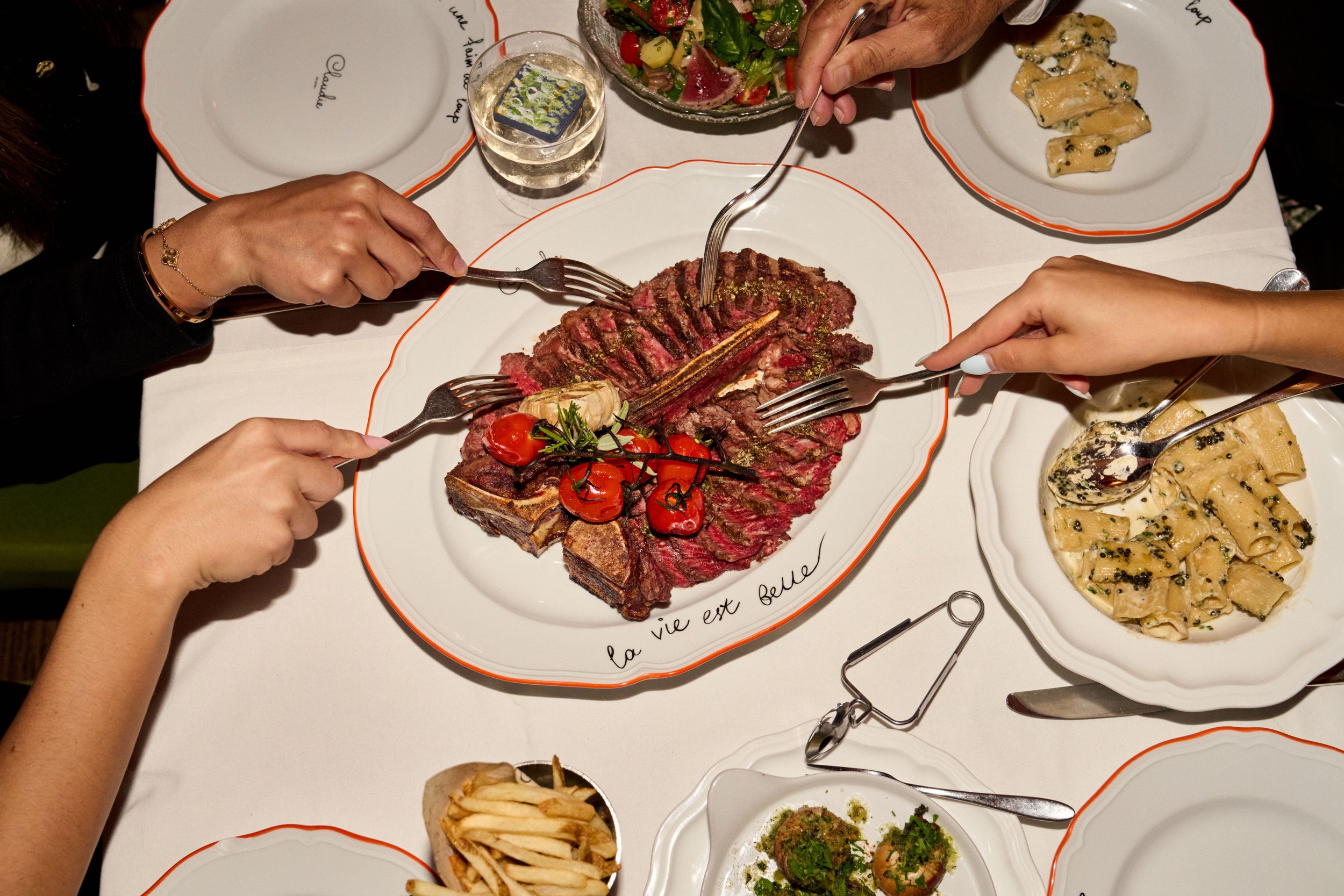 One of CLAUDIE's menu items in the center being served for four guests.