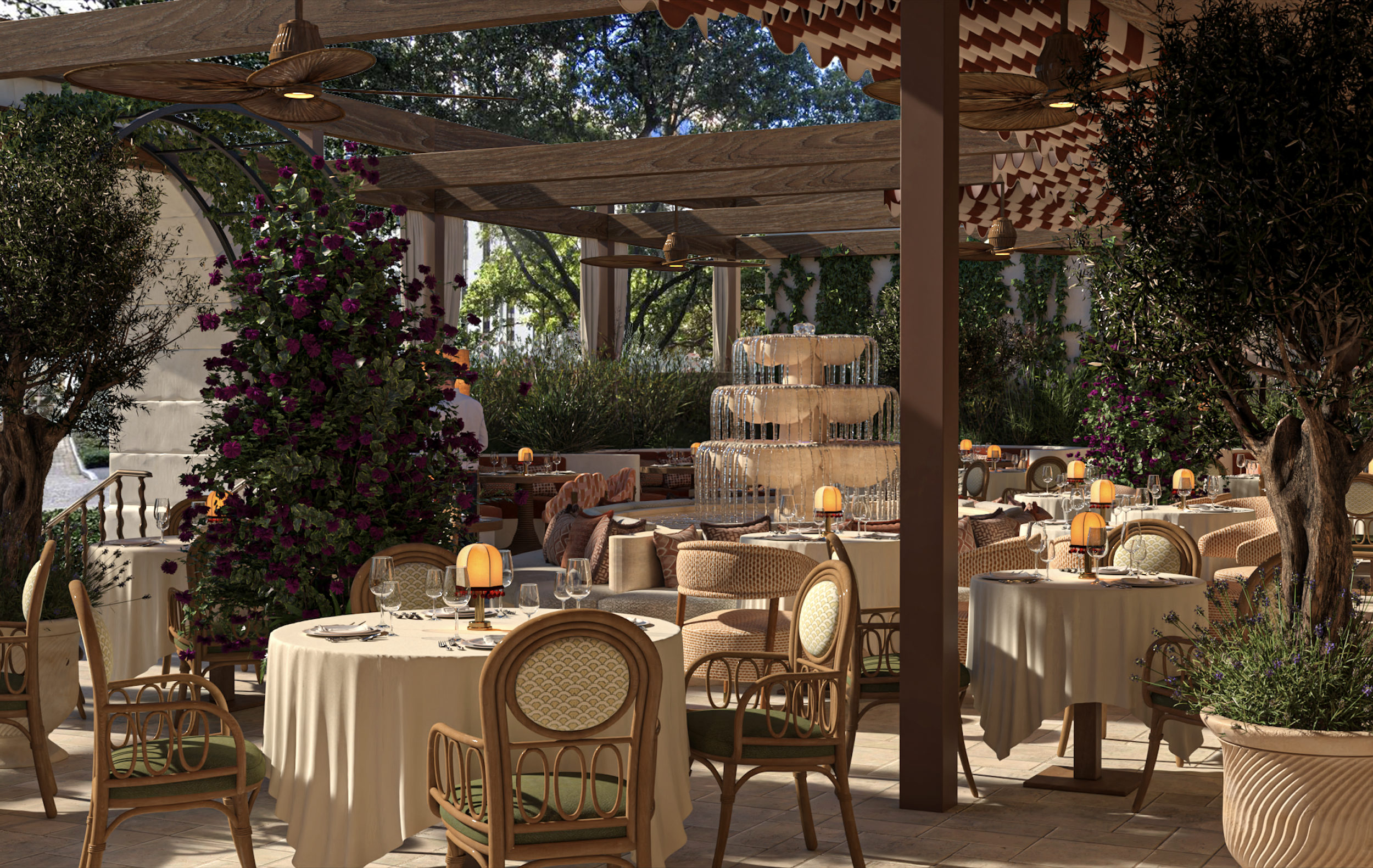 Image of CLAUDIE's outdoor dining set up, showcasing the water fountain in the middle.