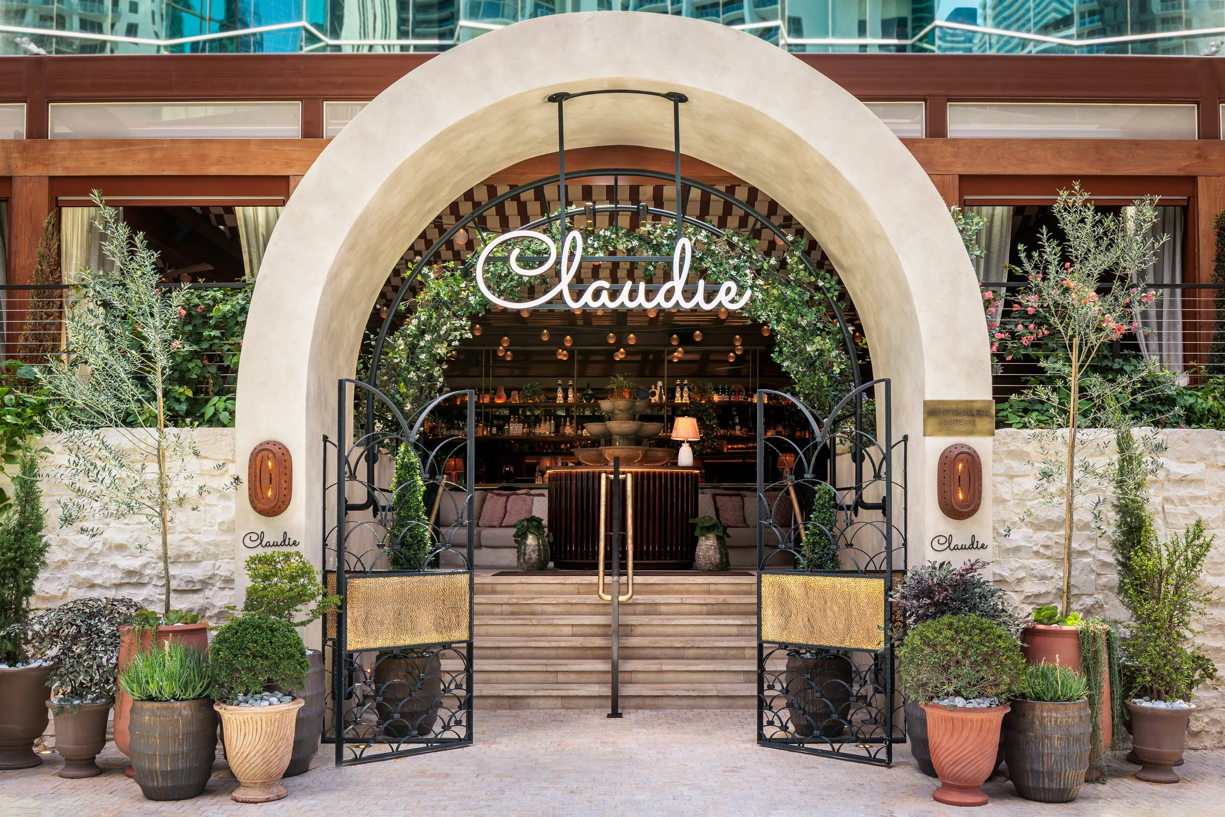 Outside of the CLAUDIE restaurant, with the entrance showcasing the Mediterranean Riviera inspiration decoration.