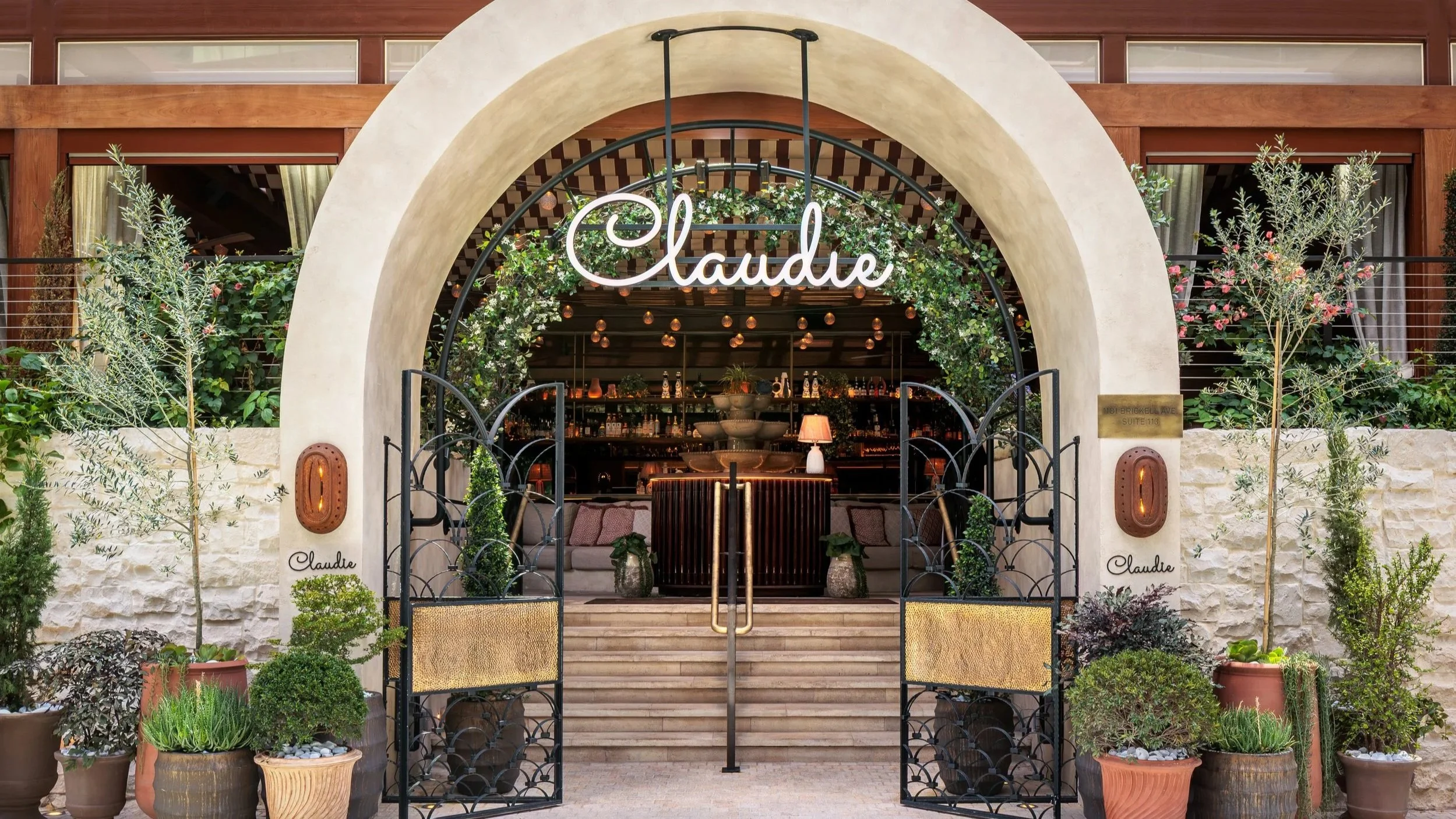 CLAUDIE's entrance, with a stone oval with steps in the front to get seated in the restaurant.