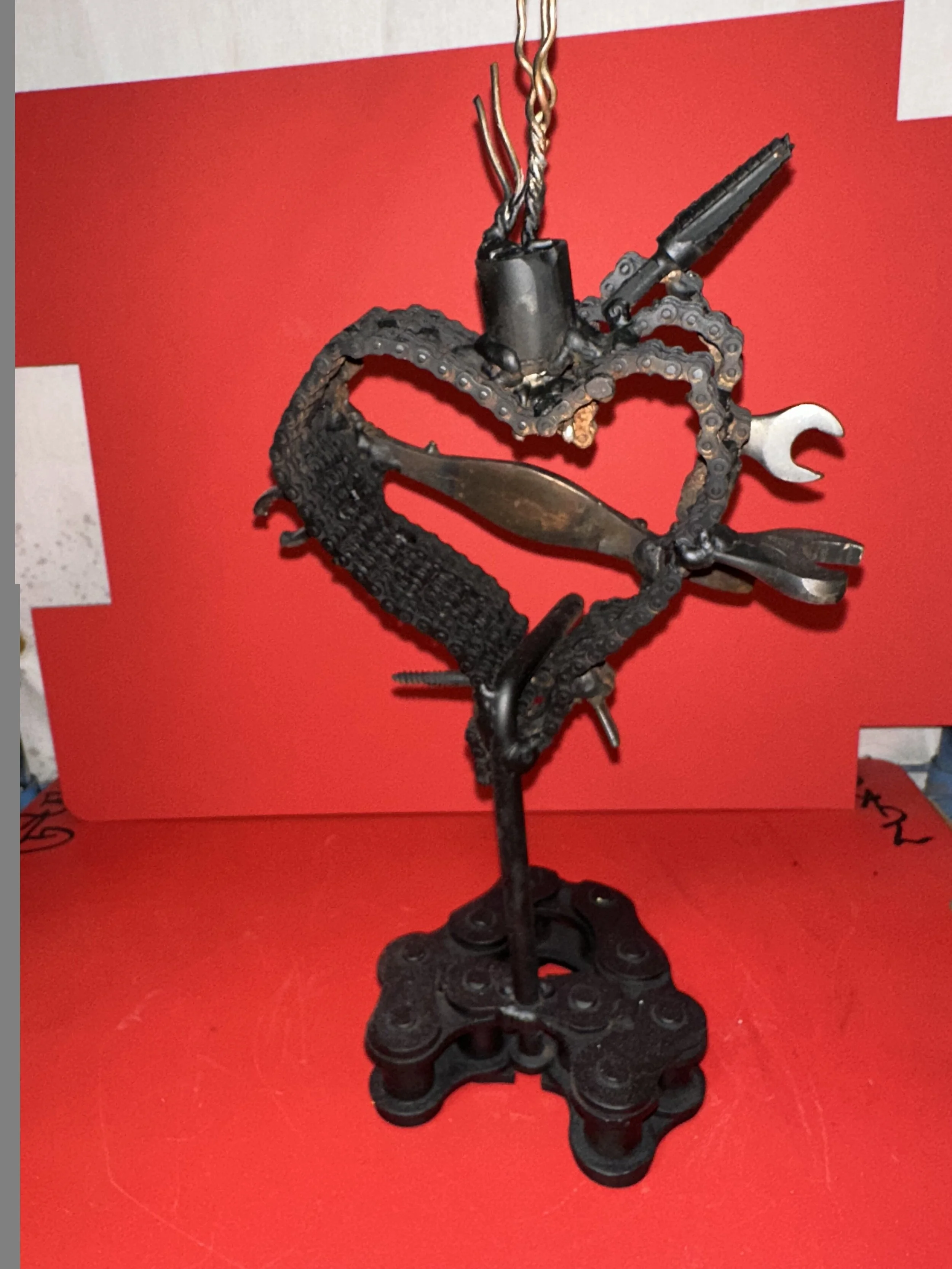 Chain, wrenches, copper wire and damascus scrap make this sacred heart.  It has a beautiful dagger being made for it as well