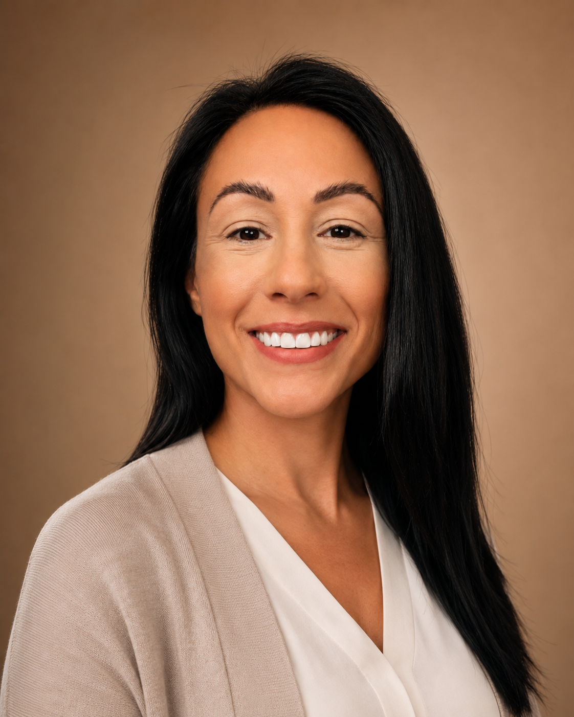 Anne Elise Pugliese, founder and psychiatric nurse practitioner, smiling in a professional headshot | Blue Lotus Telepsychiatry
