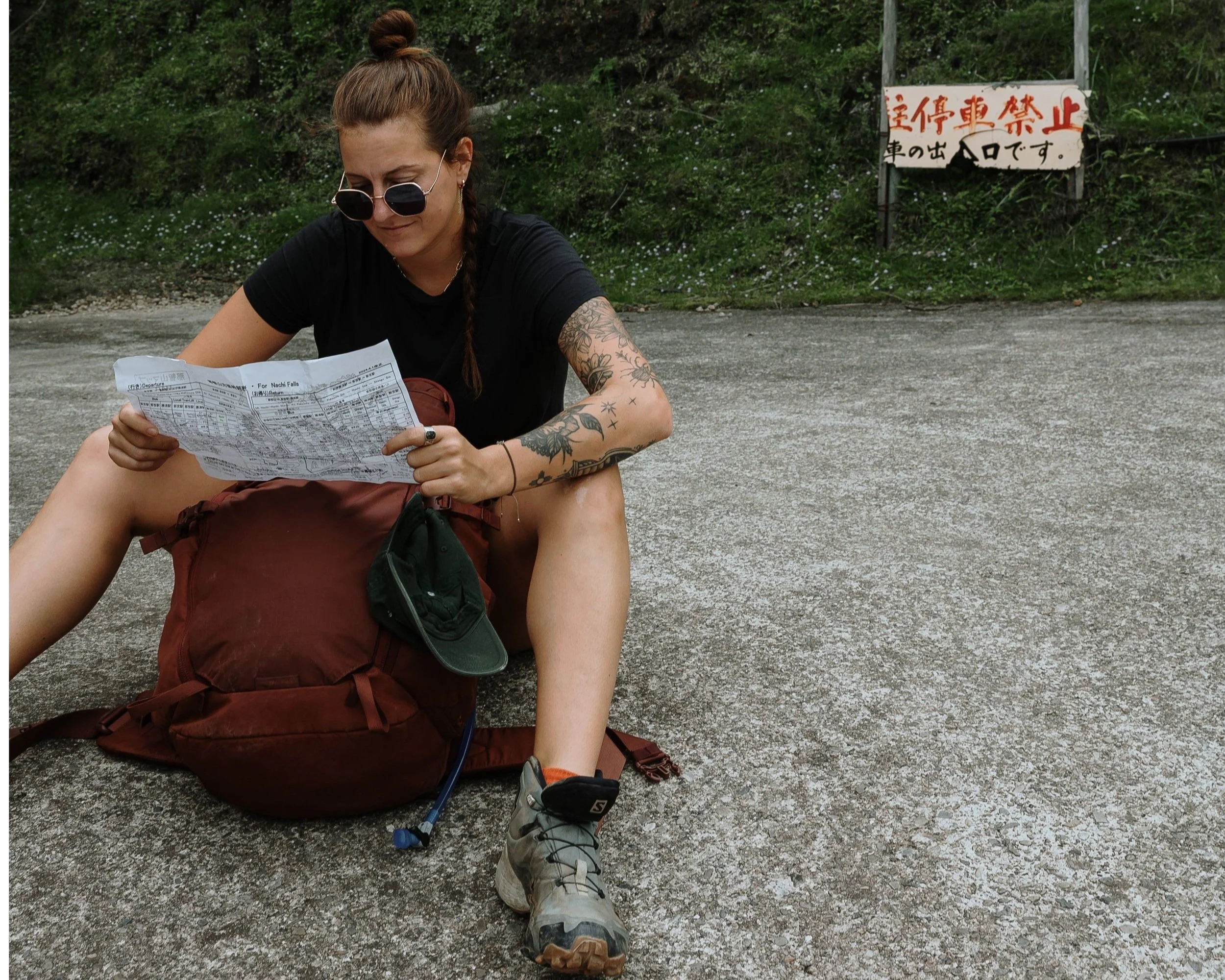 A professional astrologer laughing in nature with a tarot card spread 