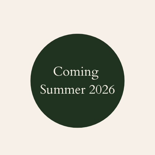 A beige background with a dark green circle containing the text 'Coming Summer 2026' in white.