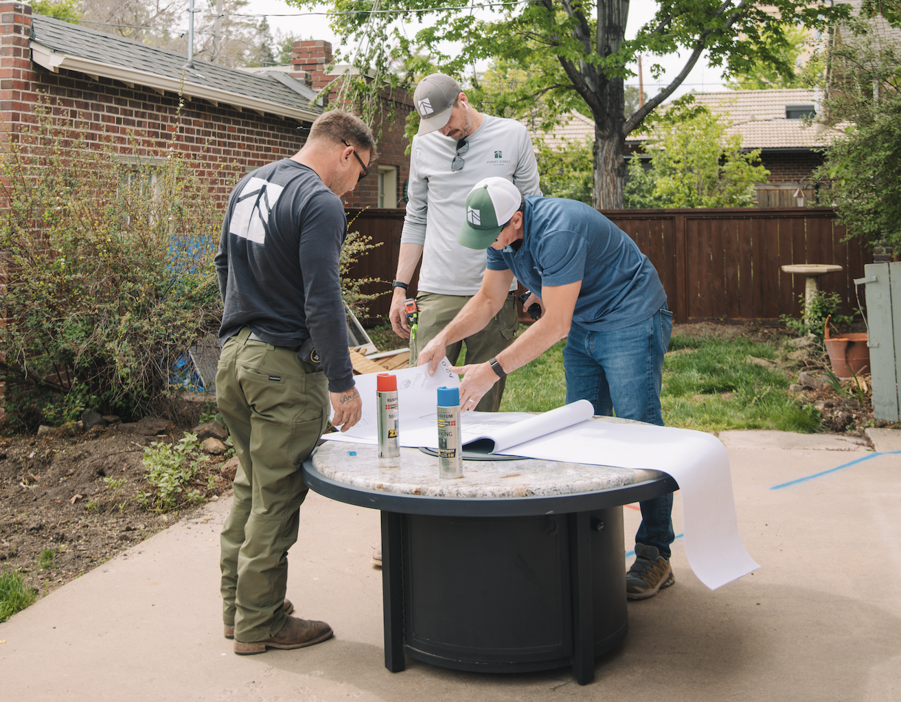 3 Men collaborating on a custom home project in Denver