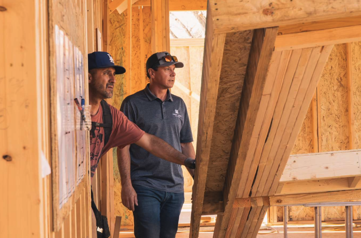 Ian Price working with a trade partner on a custom home in Denver