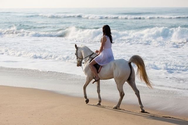 Horseback riding on Sayulita Beach near our luxury vacation rentals and boutique hotel.