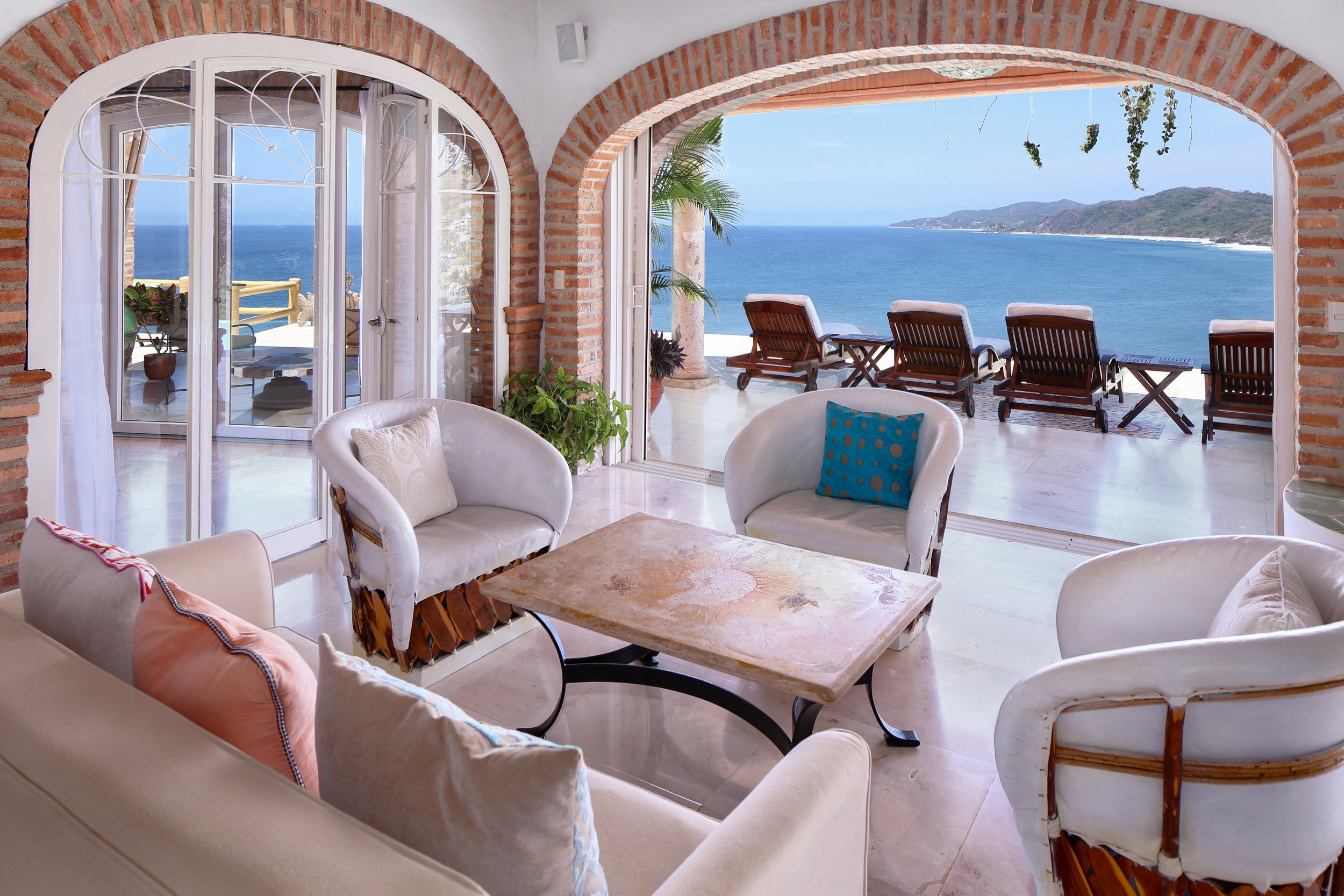 Ocean-view living room with arched doorways at Gran Villa Main Floor in Sayulita