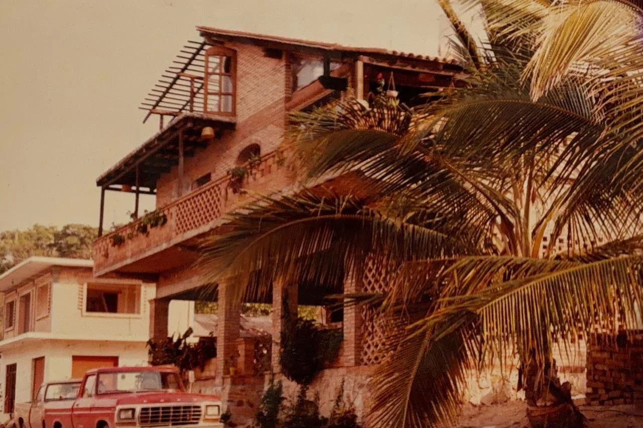 Sunset view of the balcony and palm trees at Hotel Sayulita Central boutique hotel