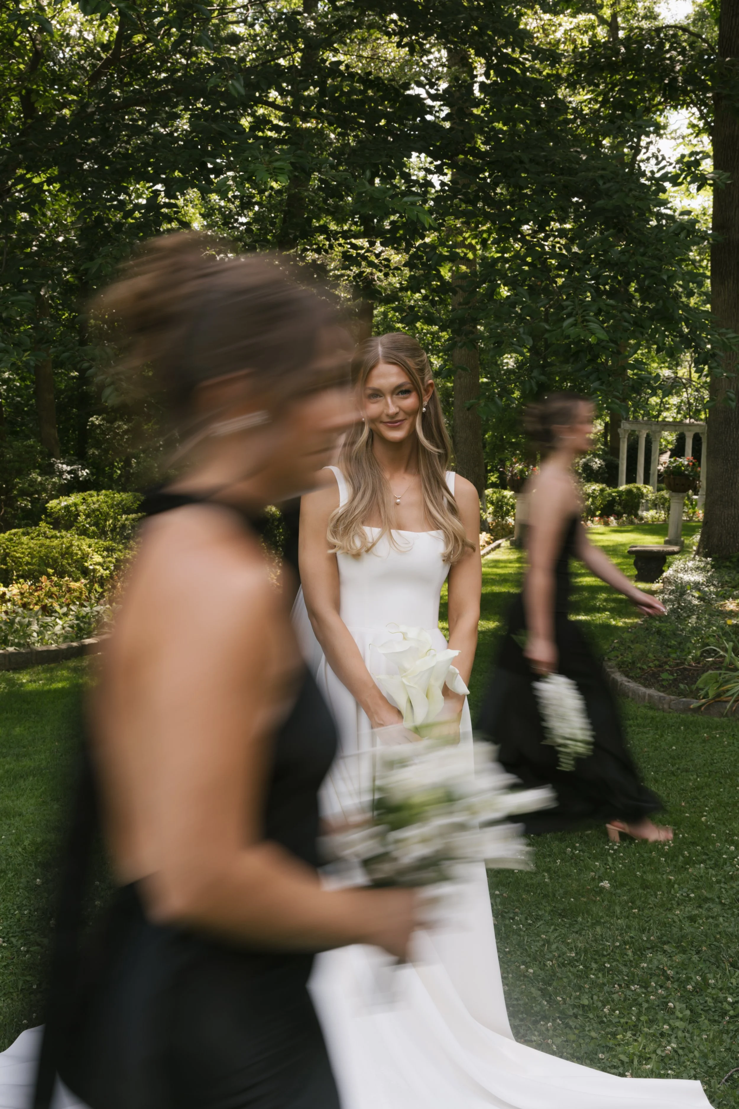 Tessa Still with Blurry Bridesmaids.jpeg