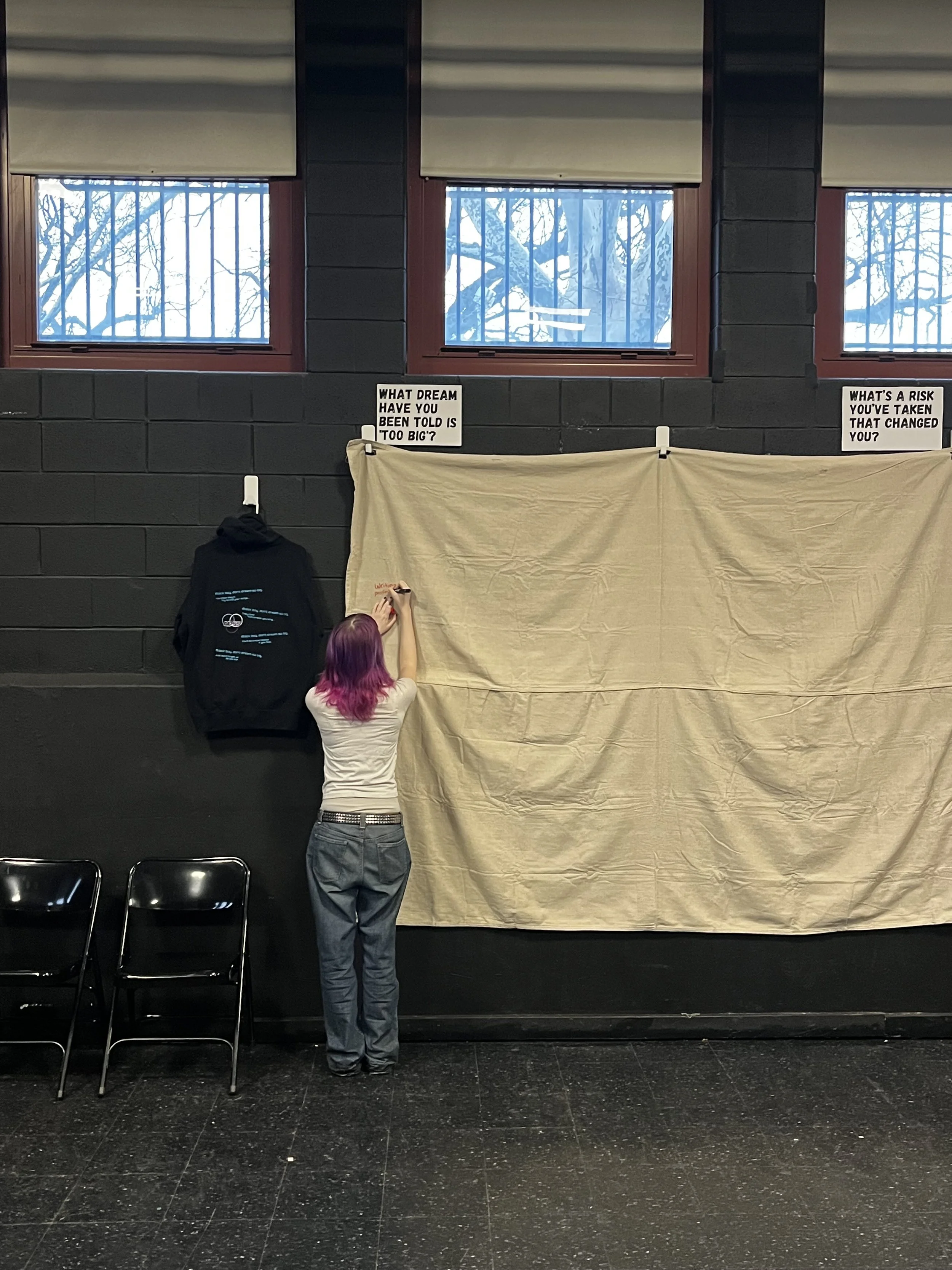 CAPA student writing on textual tapestry