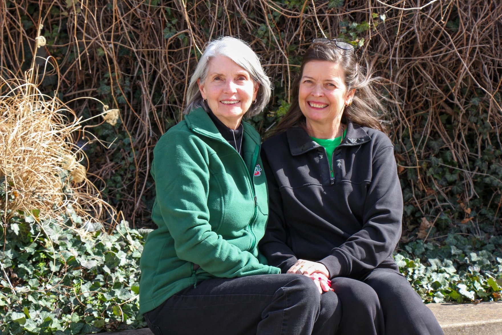 two women smiling at the camera