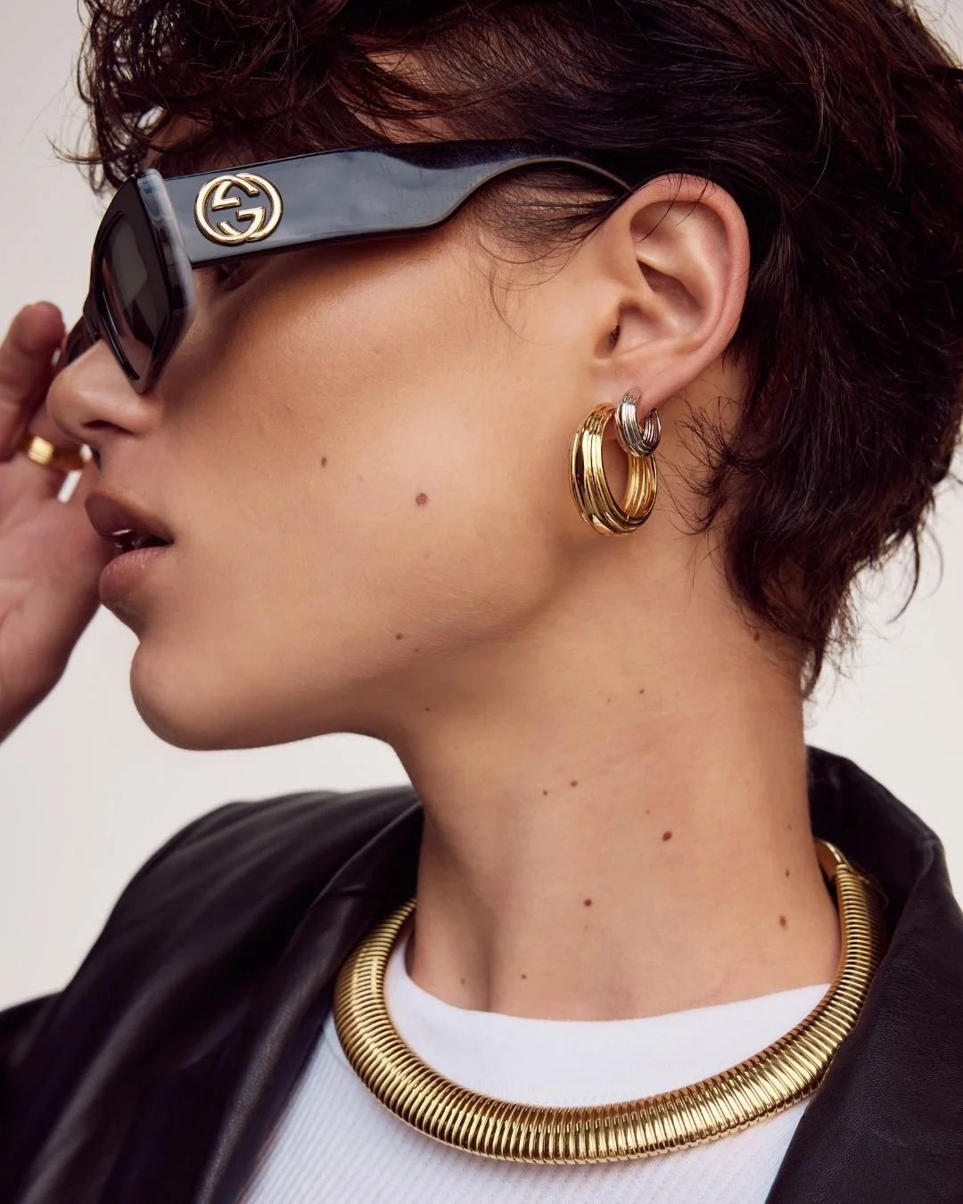 Model wears LUV AJ Gold and Silver hoops with Gold choker