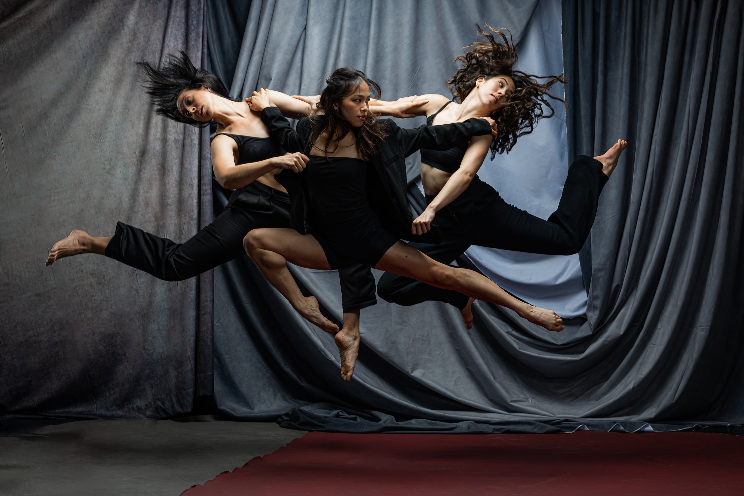 Contemporary dance group poses in studio Stock Photo by NomadSoul1