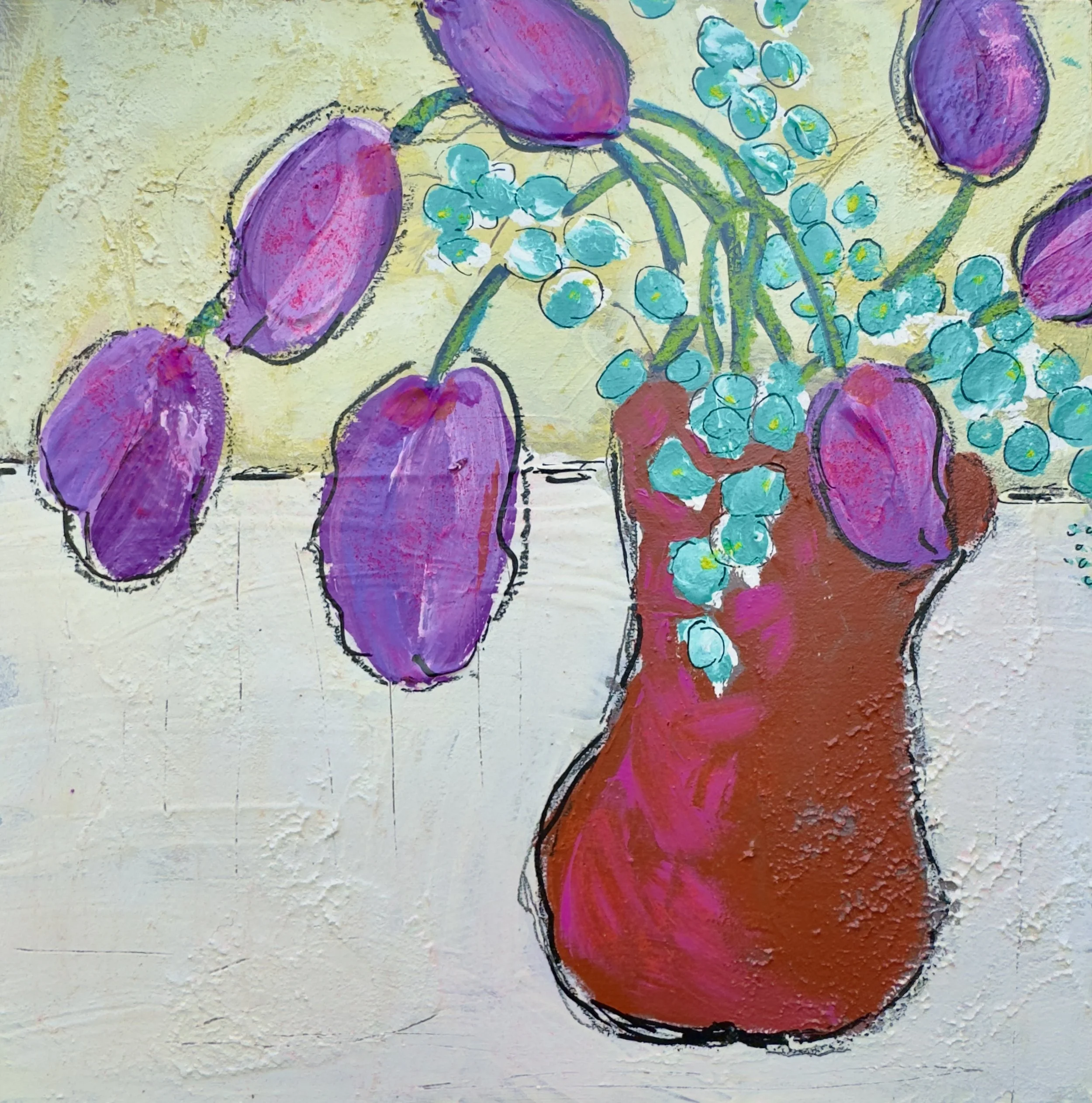 Close-up of a colorful, abstract painting featuring purple, pink, turquoise, and red shapes with textured brushstrokes.
