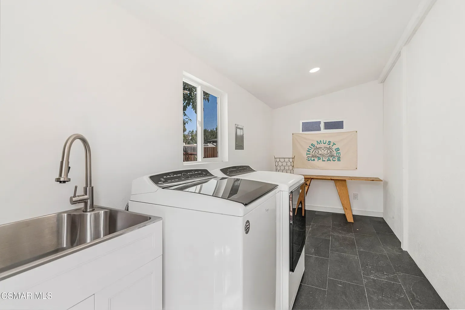 Detached bodega includes a utility area that can also be used as a creative space. 