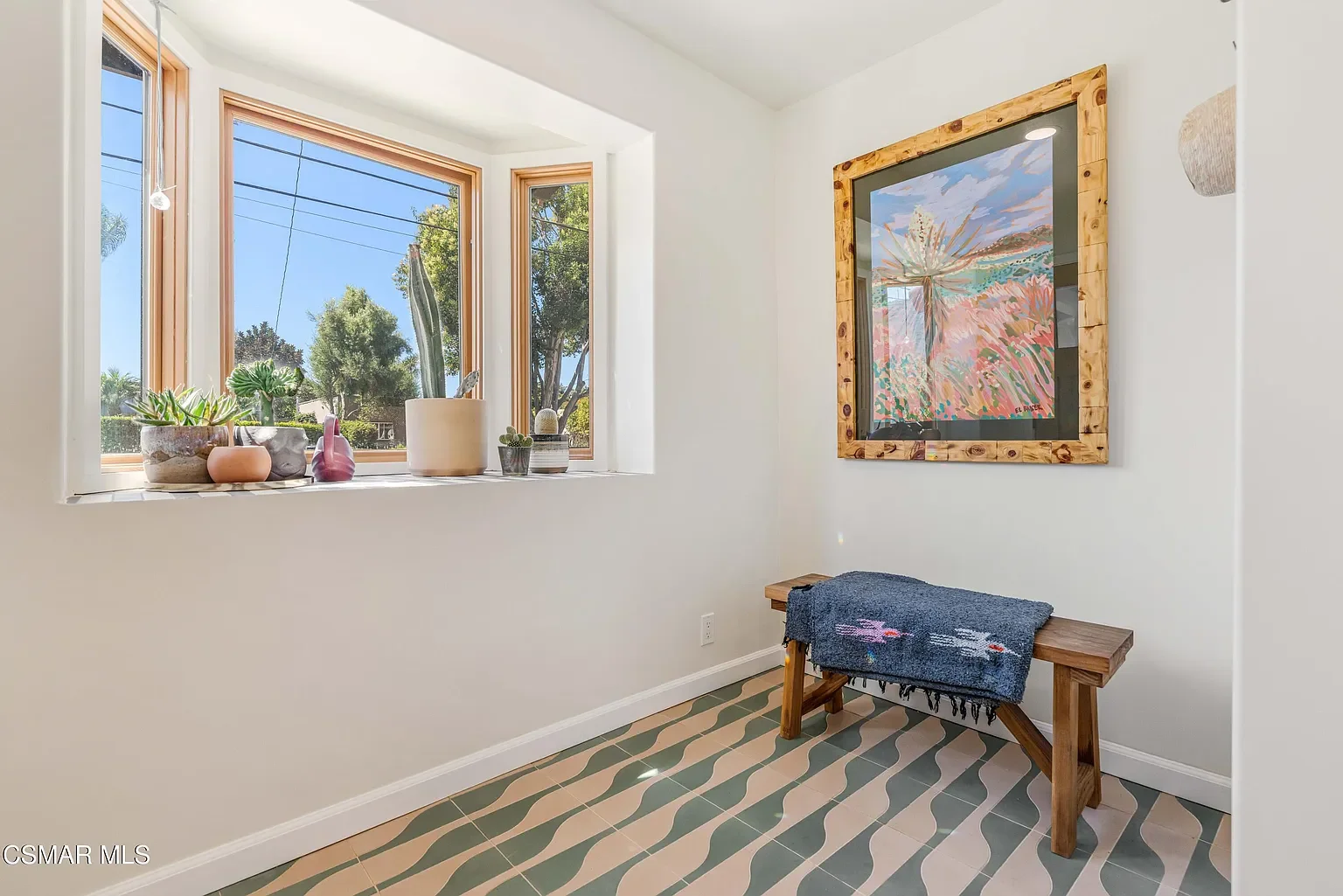 Clean and bright entry with casement windows and bold flooring spells fun in the fun. (tile: Zia cement /bottle in a 2 color way design. 