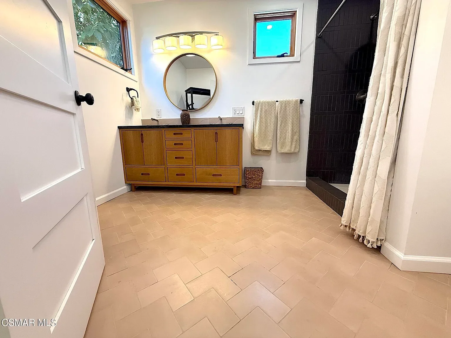 Master bath/ Custom double vanity / and a geometric format of an encaustic artisan tile. 