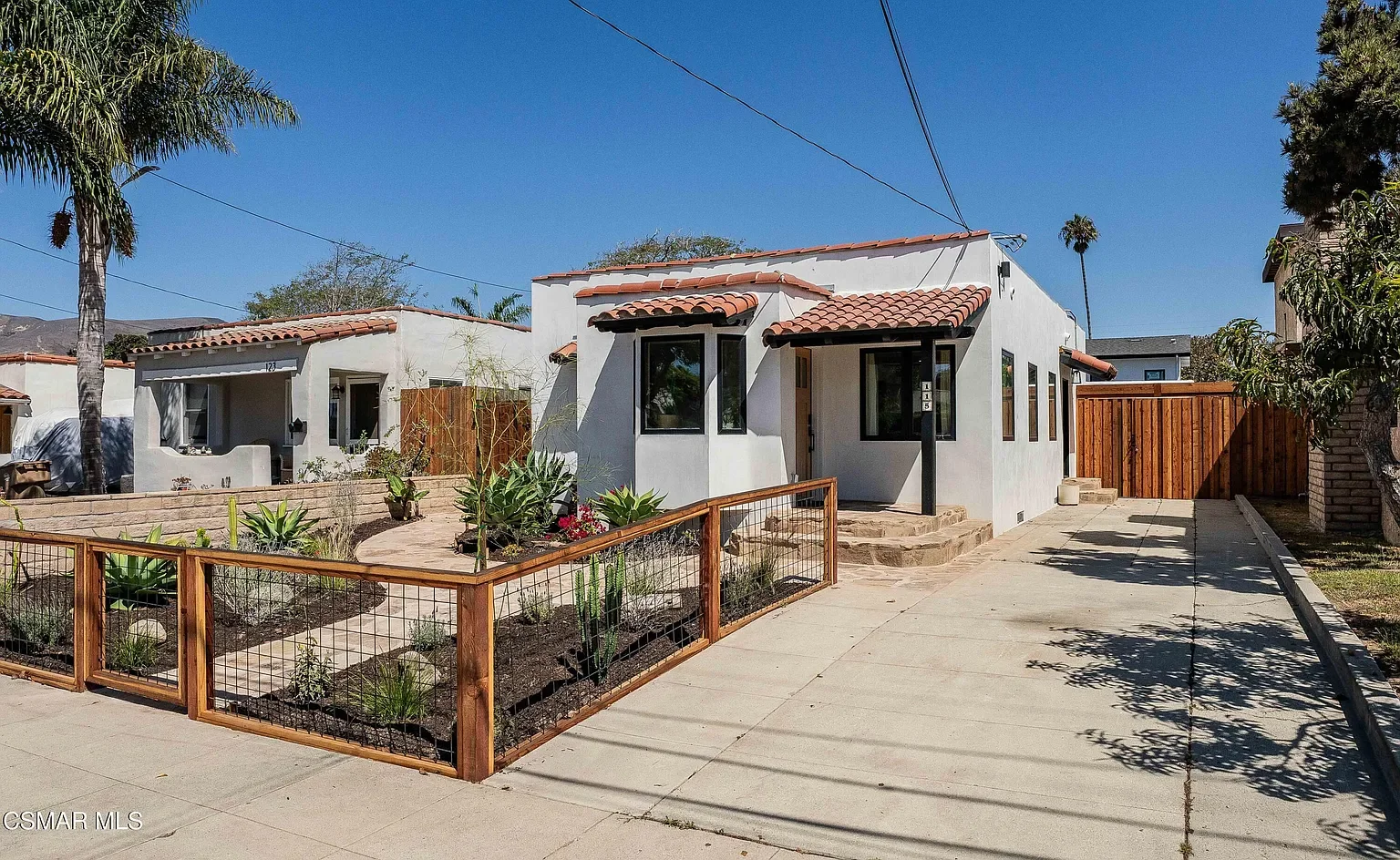 Fresh, smooth stucco in a classic white was a key element to bring the exterior up to date and get that fresh, modern look. 