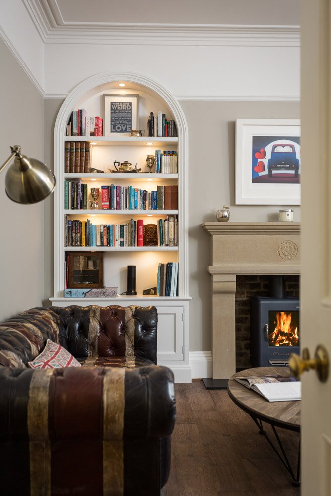 one point perspective of Livingroom fireplace with log burner and fitted book shelves