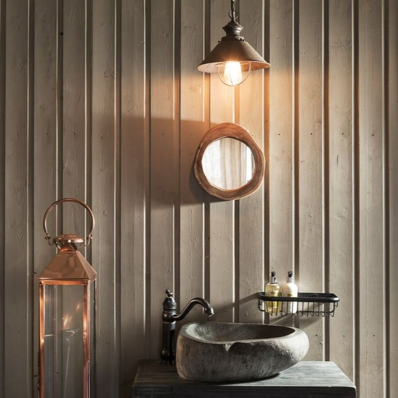 detail shot of bathroom sink, sage green wood panelled wall, [pendant light, circular mirror above circular stone sink