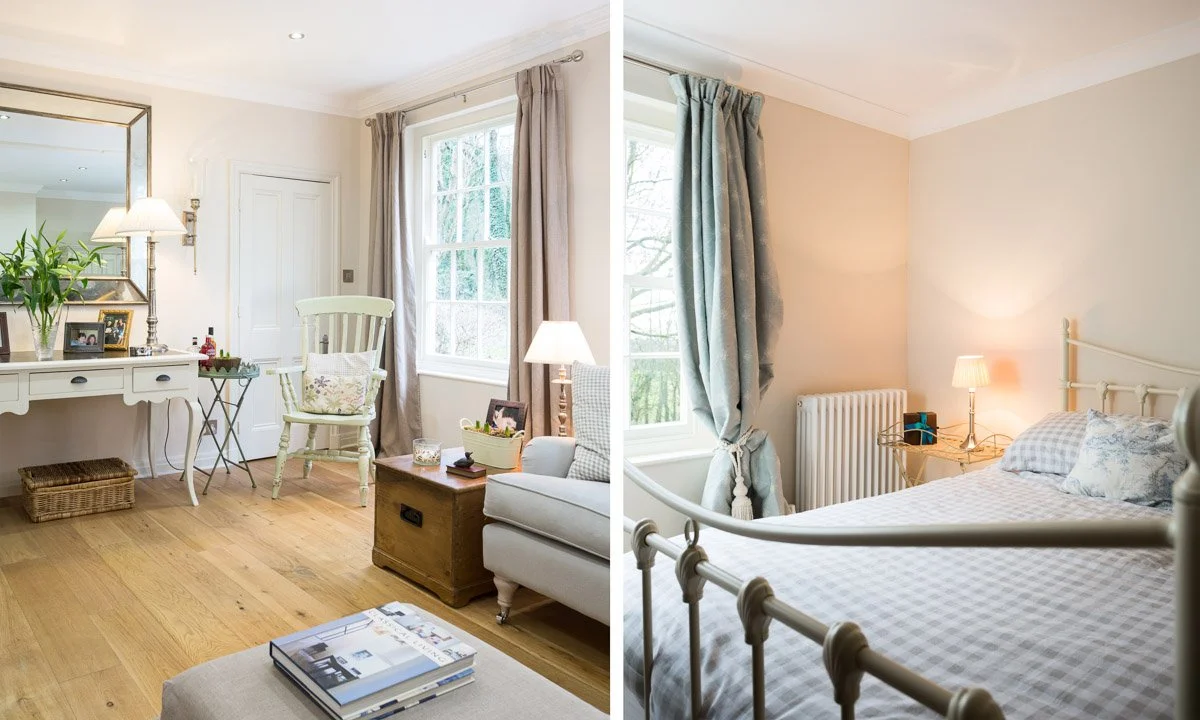 left: corner of room, bench table with mirror above, sash window on right hand wall and small wooden arm chair, right: detail looking across bed towards bedside table with tall sash window and blue draped curtains 
