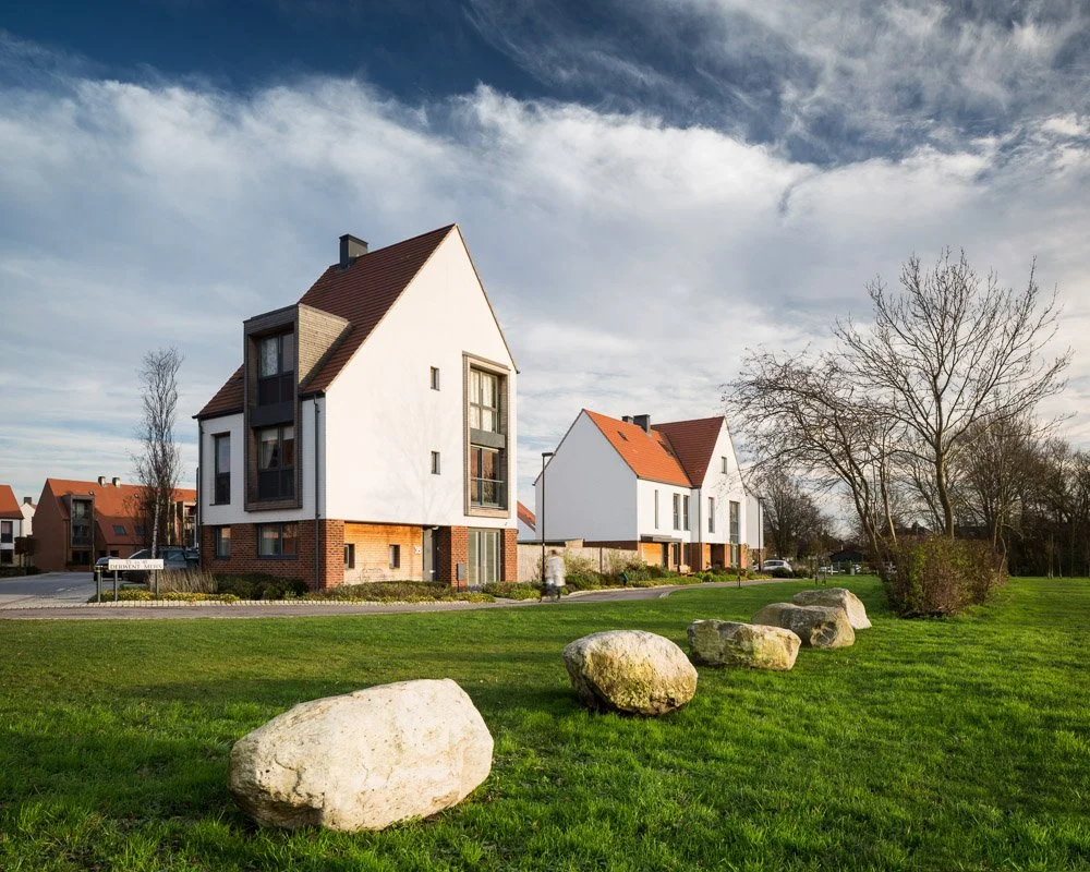 tall white eco houses 