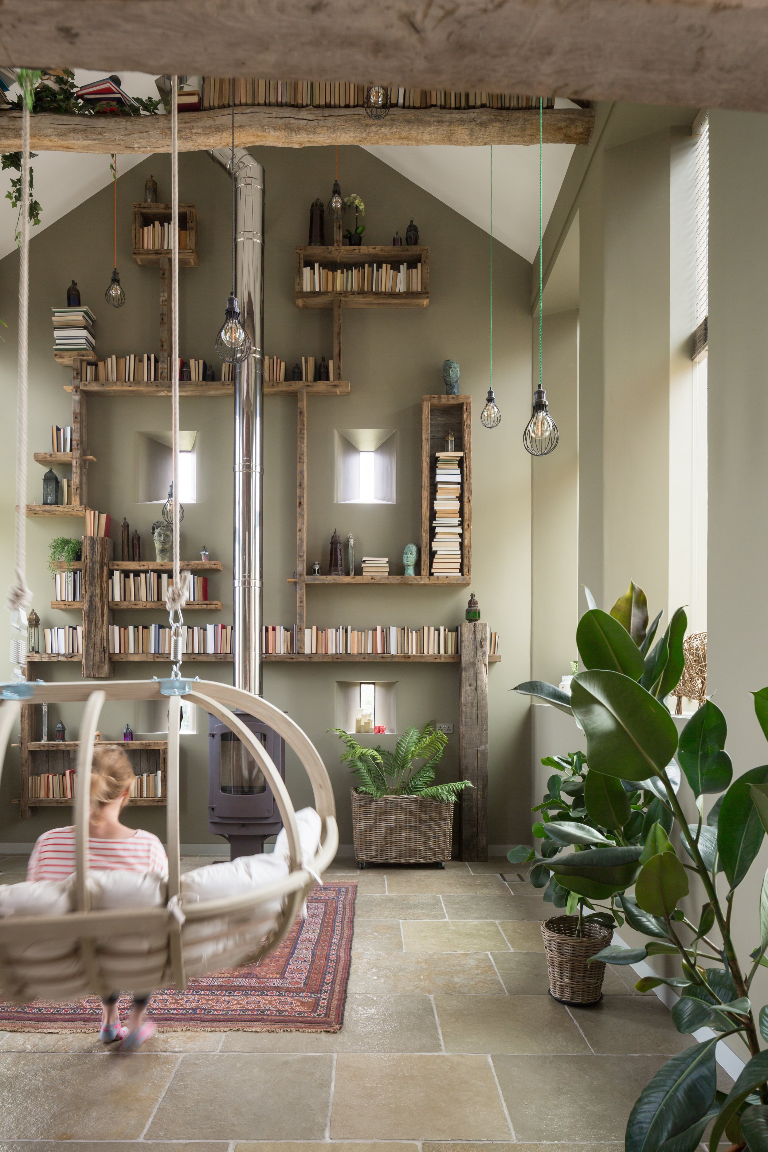 hanging chair in double height library space