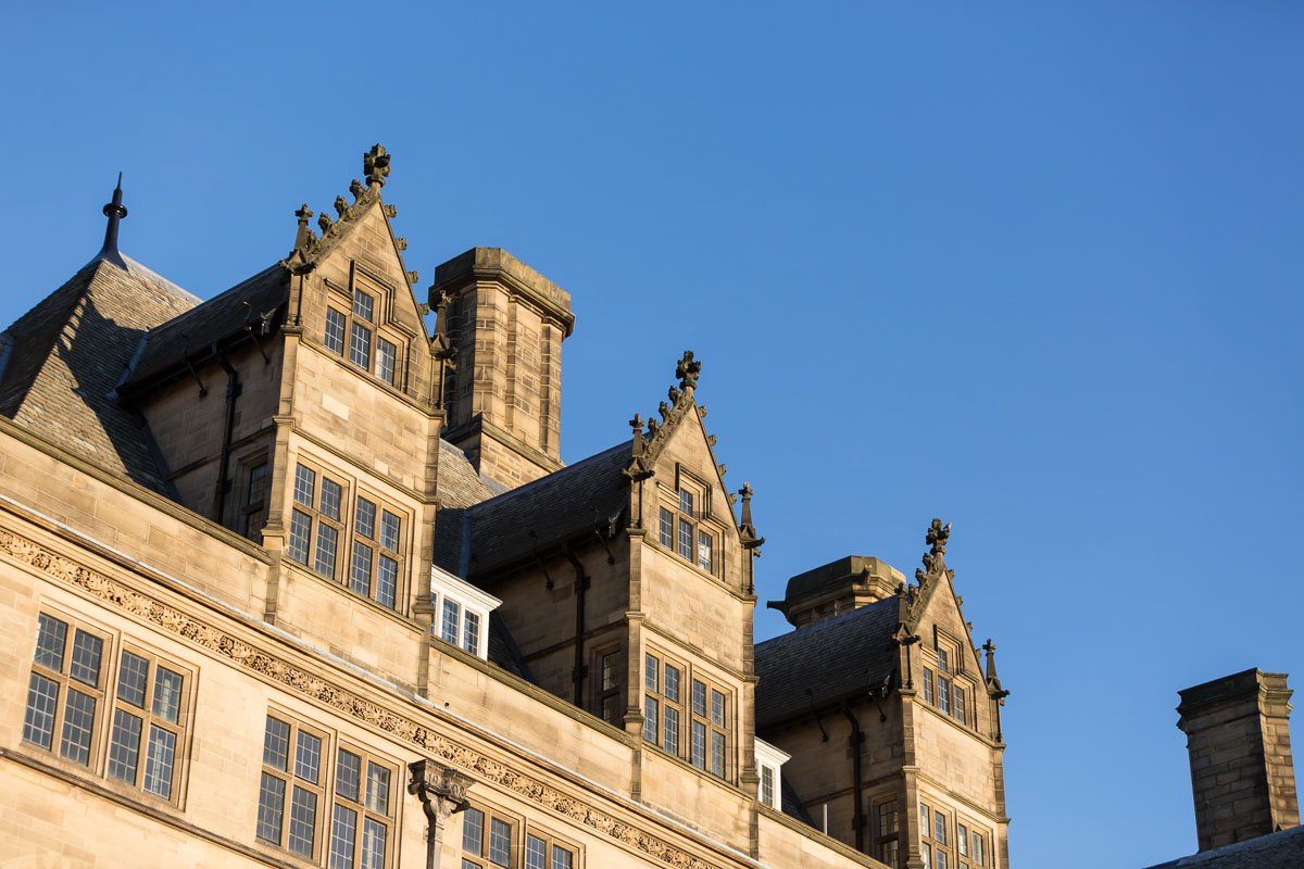 detail of the top of bradford city halls windows and rooftop