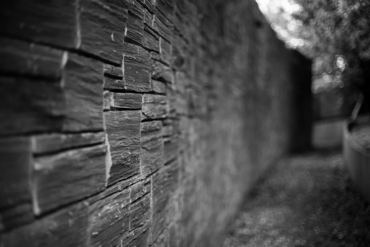 close shallow depth of field image of detailed external stone work