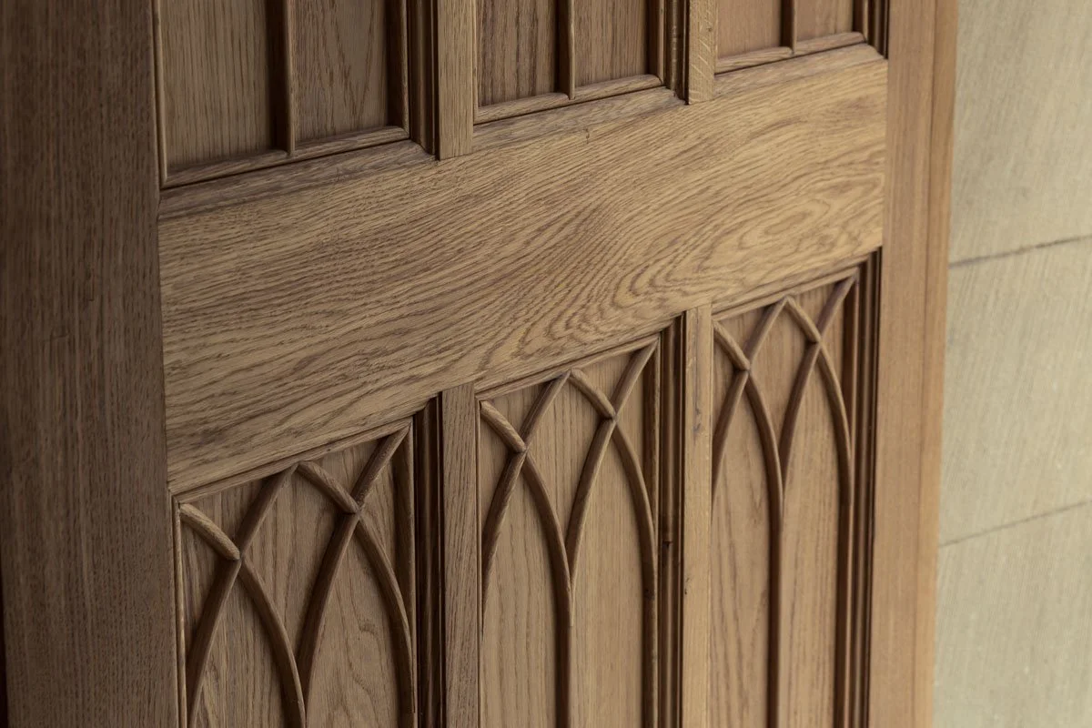 close up detail of intricate woodwork on door