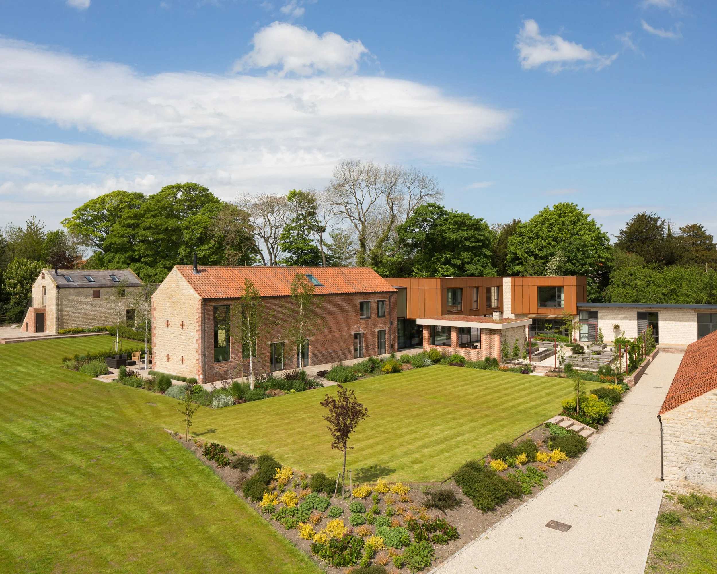 Manicured gardens and different masses of contemporary yorkshire house