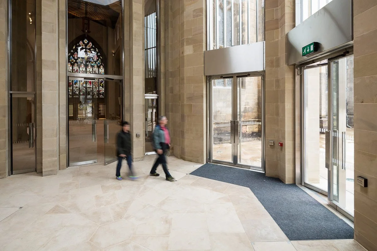people walking out of main doors of sheffield cathedral 