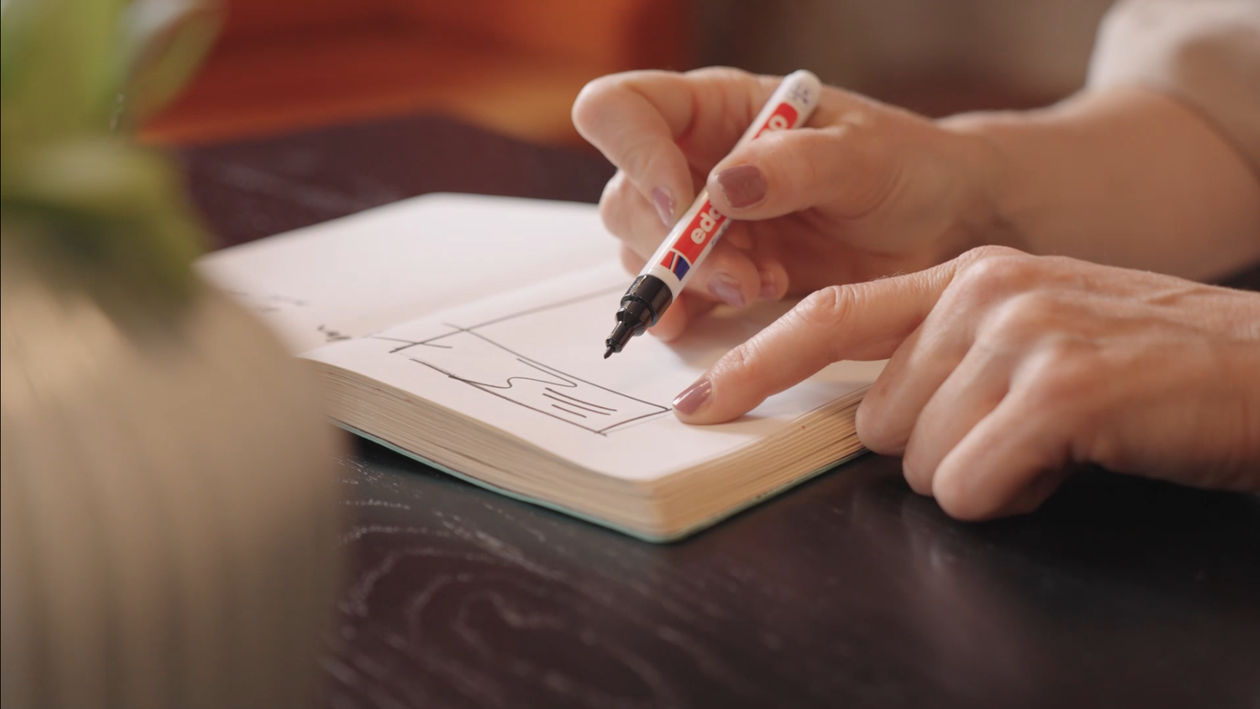 Lisa Lang sketching ideas during the design process