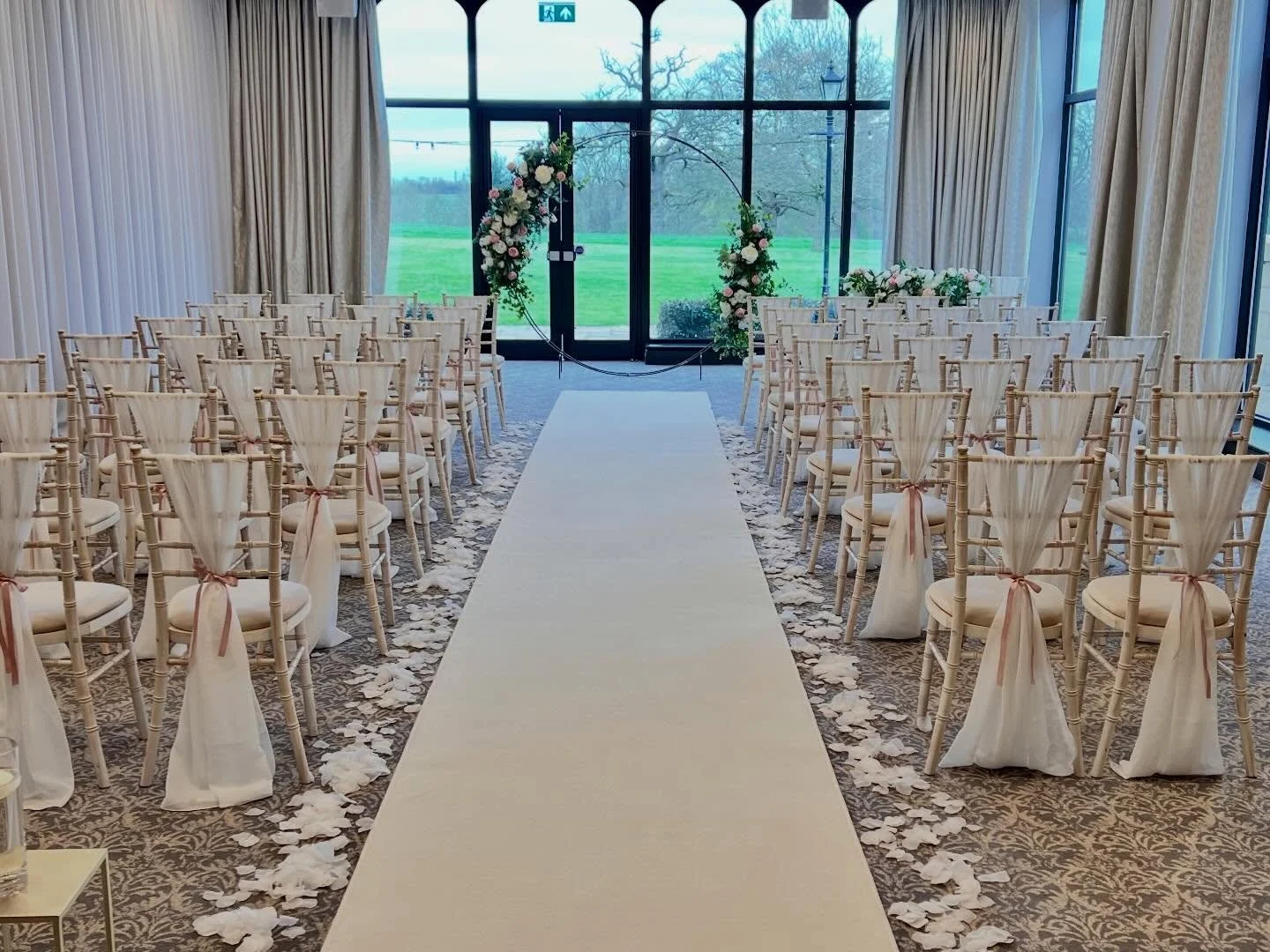 Kayleigh &amp; Mark.
This was a beautiful wedding to dress at @rookeryhallhotelspa. 

We supplied the ceremony decor which included white chair drapes finished with a pale pink ribbon and a minimalist style moongate arch that then moved to the top ta
