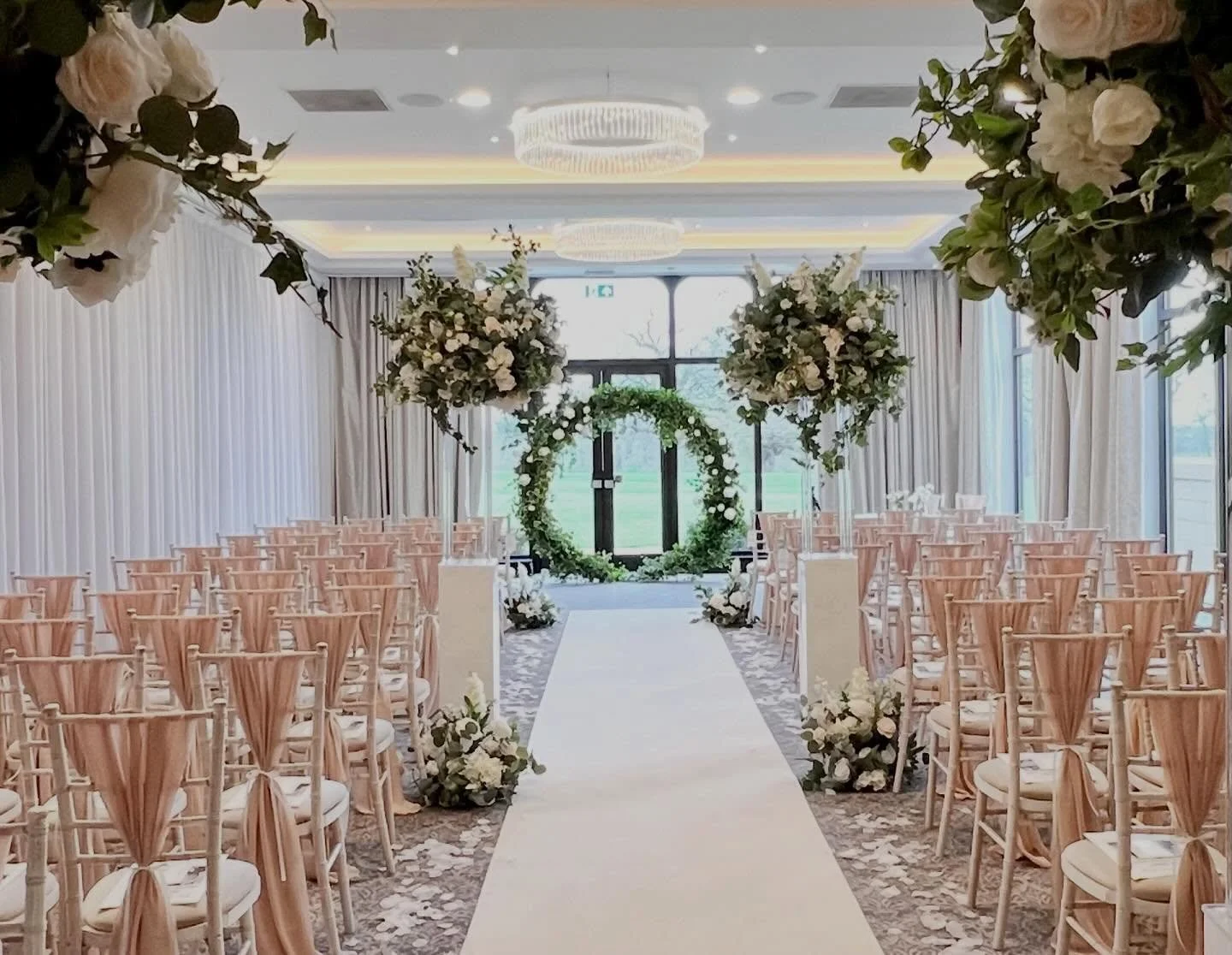 Abigail &amp; Daniel.
A truly beautiful set up at @rookeryhallhotelspa this weekend.
We supplied soft dusky pink chiffon drapes on the chairs along with luxurious tall florals that lined the aisle (which then became the wedding breakfast centrepieces