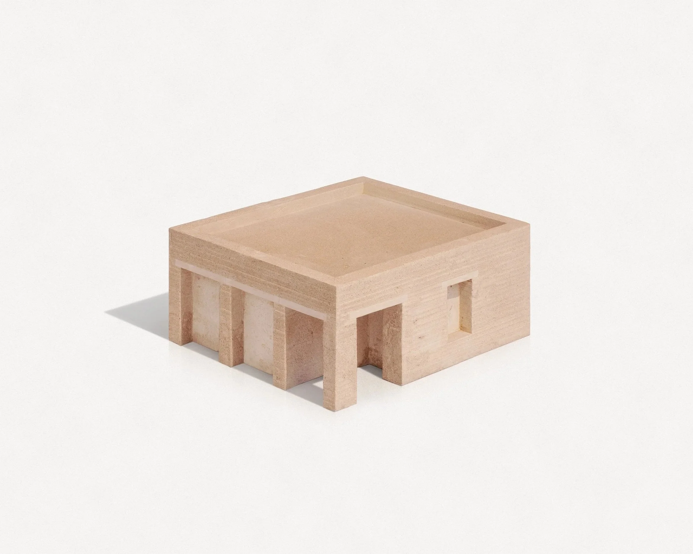 A small wooden table with square top and open space underneath, placed on a white surface against a plain white background.