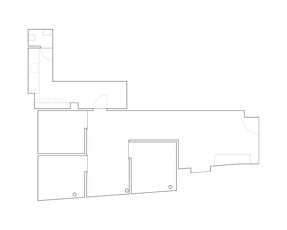 Floor plan of a house showing multiple rooms, including a kitchen, living area, bathrooms, and bedrooms.