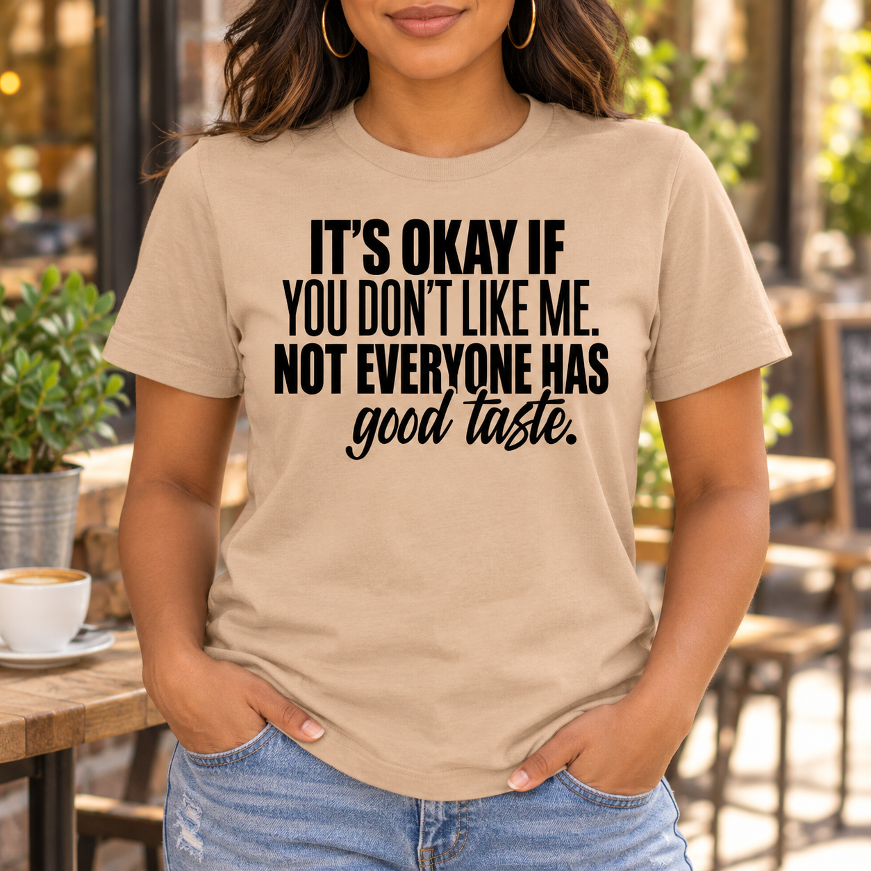 Not Everyone Has Good Taste Sarcastic Tee front print on a tan crewneck tee. AI-generated lifestyle mockup.