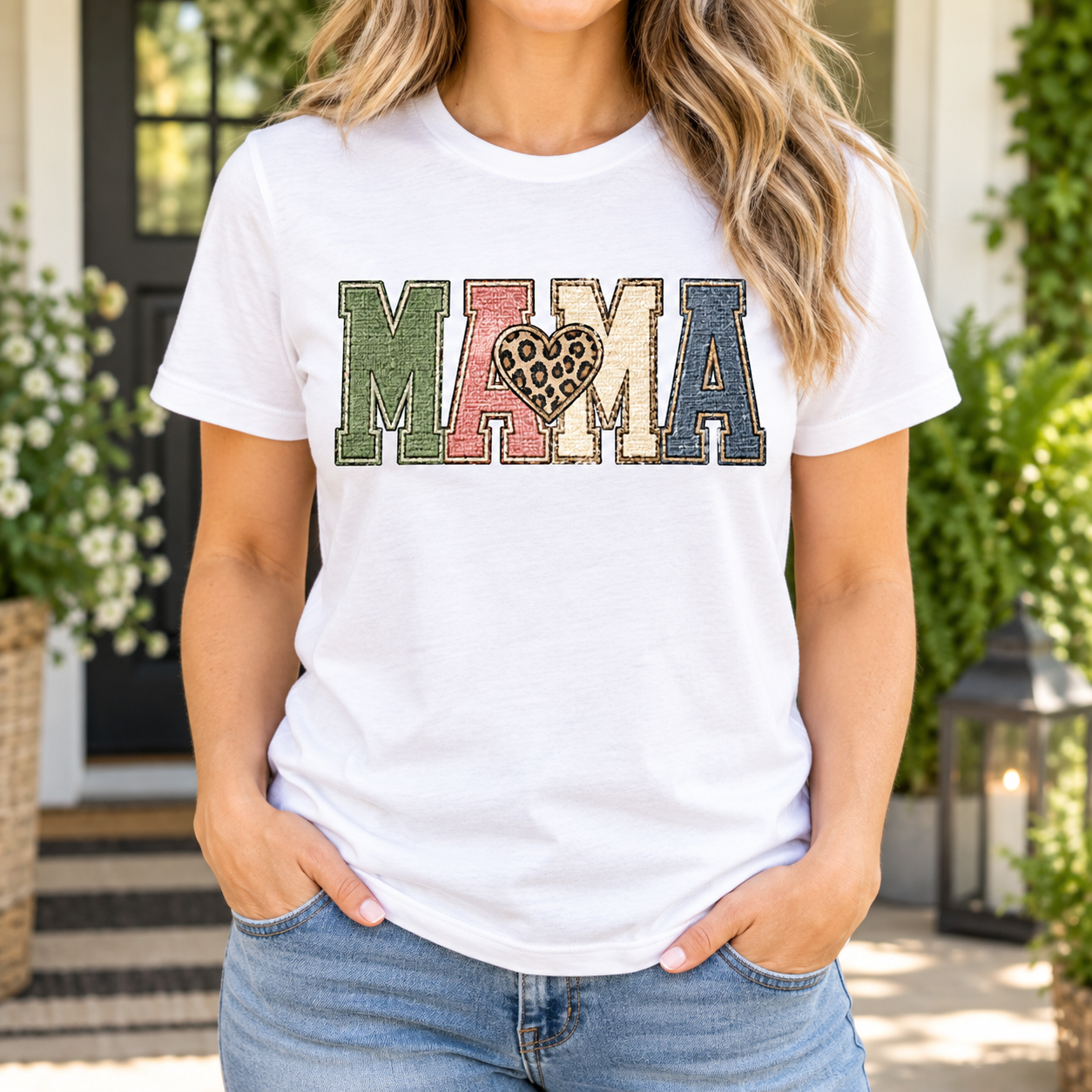Patchwork Heart Mama Tee front graphic on a white unisex crewneck tee, AI-generated lifestyle mockup.