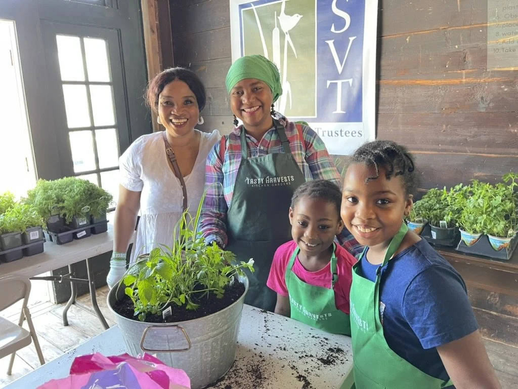 Safiyat the food garden educator with her students