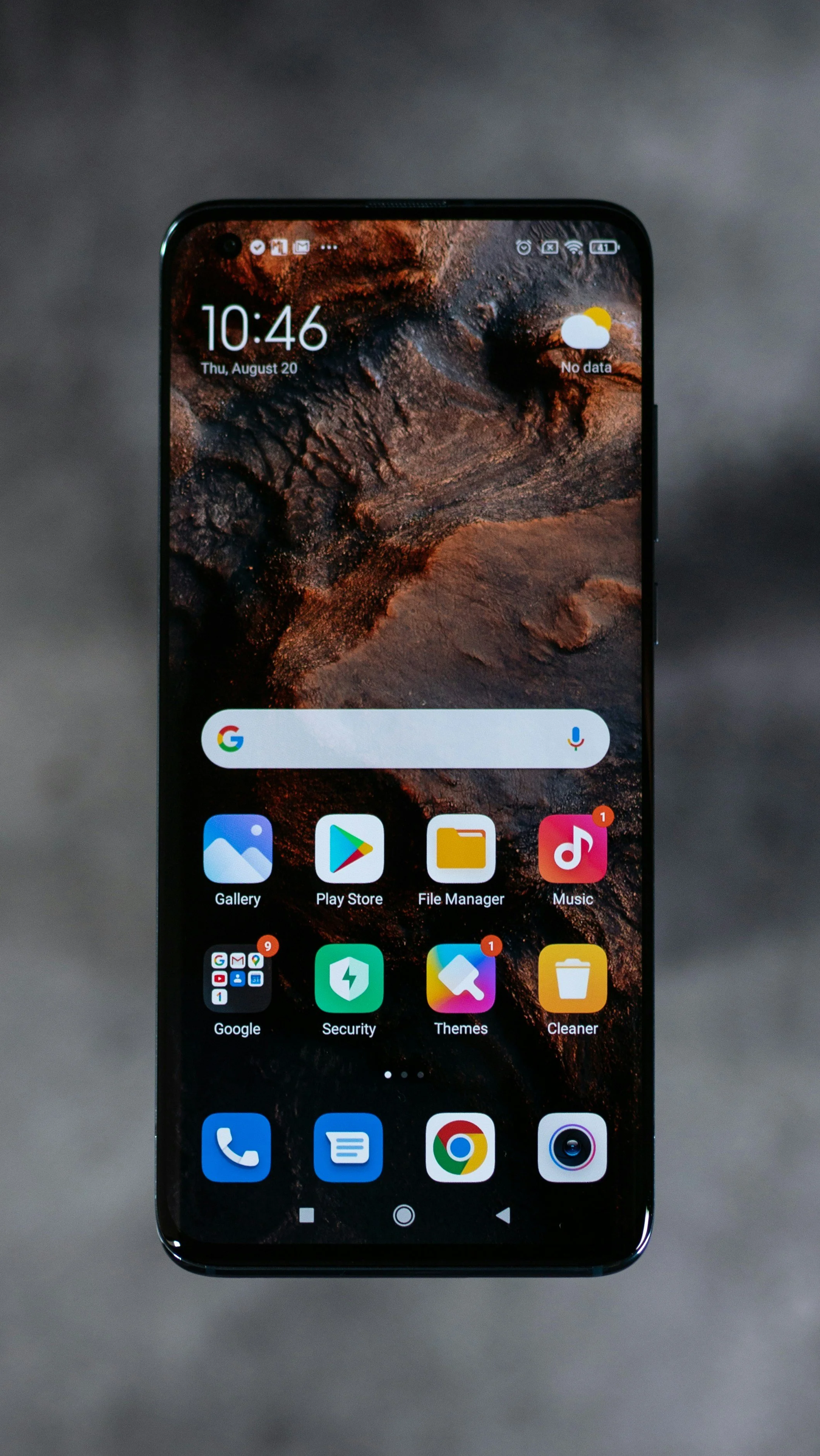Close-up of an Android smartphone home screen showing common apps like Google, Play Store, and Gallery, representing learning how to navigate an Android device and get help with everyday phone questions.