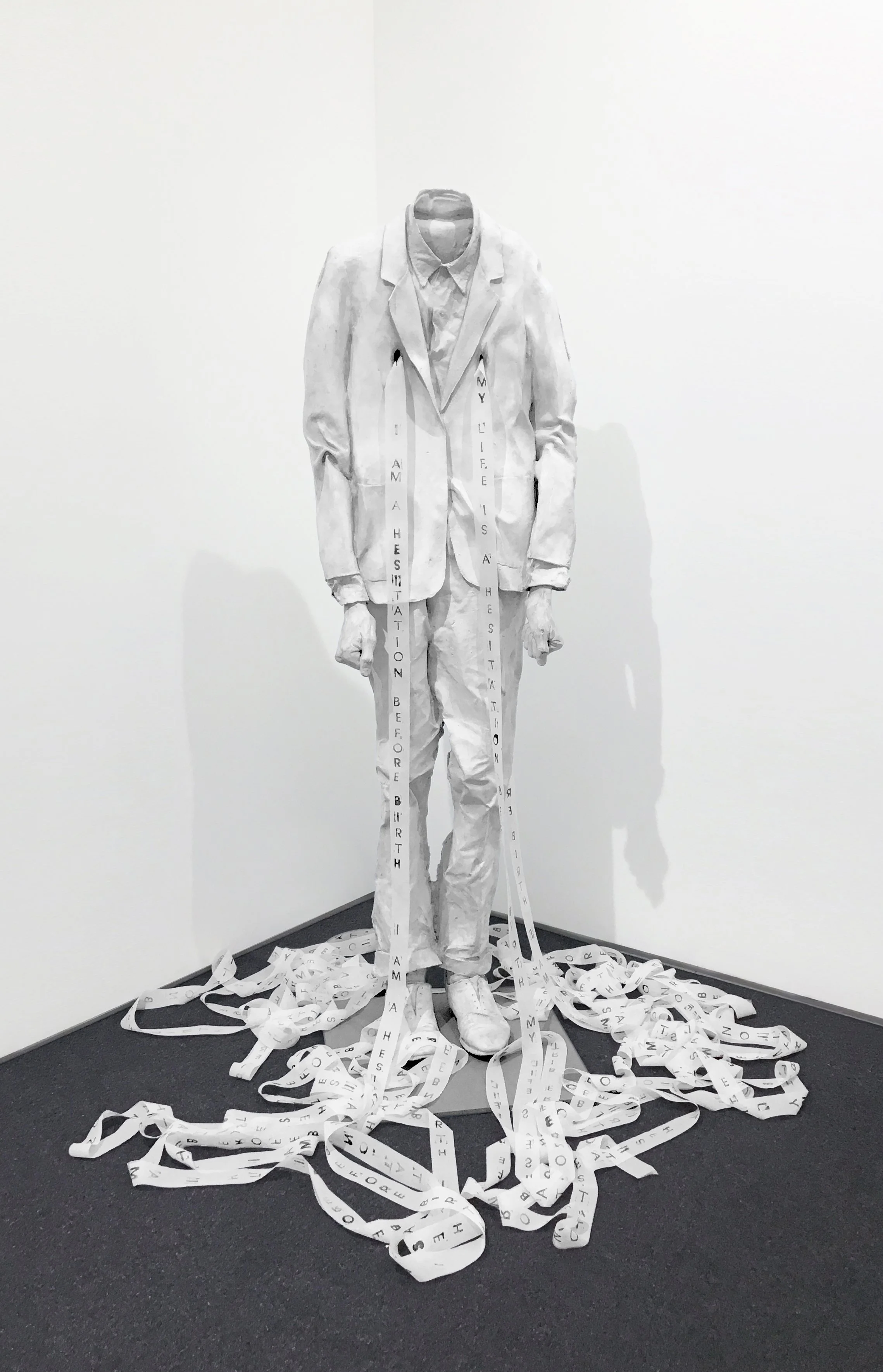 LESLEY DILL: WORD THROUGH - "I AM A HEISTATION BEFORE BIRTH. MY LIFE IS A HESITATION BEFORE BIRTH." FRANZ KAFKA, 1998, cast aluminum, oil paint, silk ribbon and salt, 60 x 19 x 11 in. 152.4 x 48.3 x 27.9 cm.
