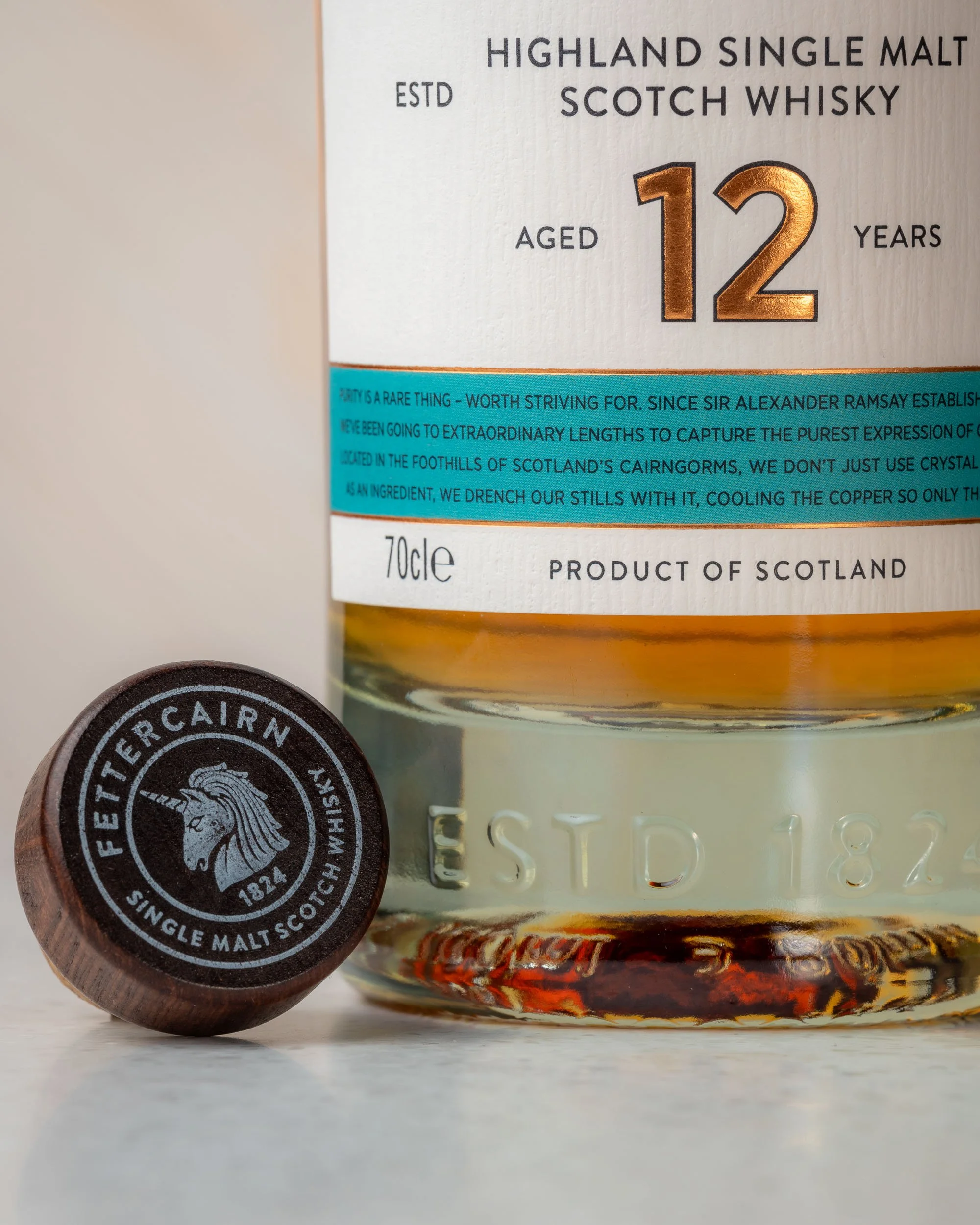 Close up of the cork next to a bottle of Fettercairn 12