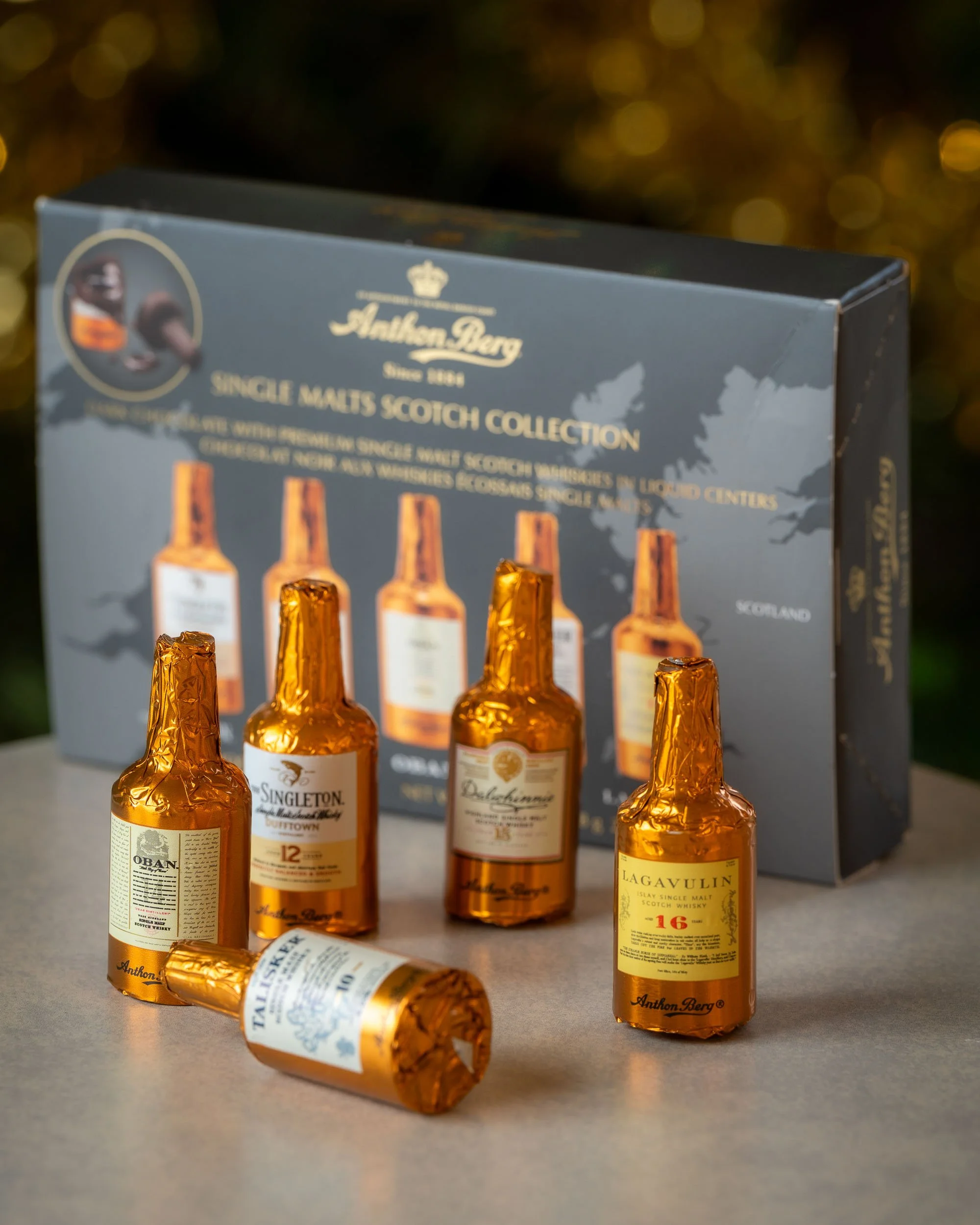 All of the miniature chocolate liqueur bottles stood in front of the Anthon Berg box