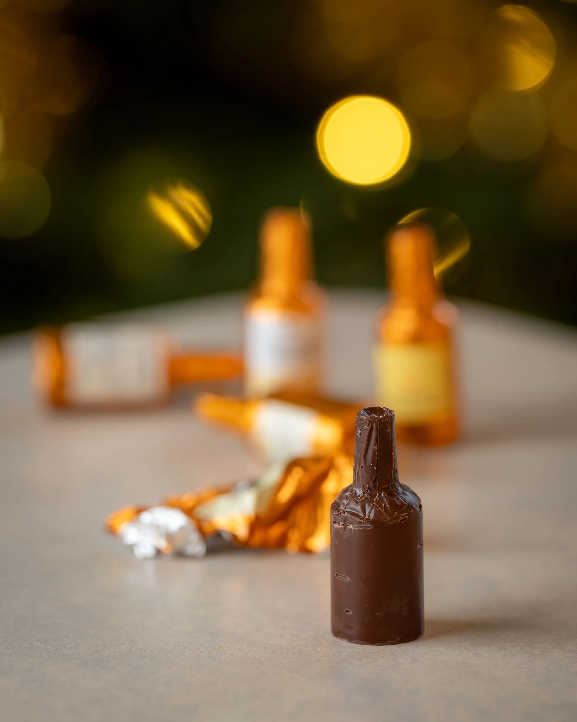 An unwrapped miniature chocolate liqueur bottle 
